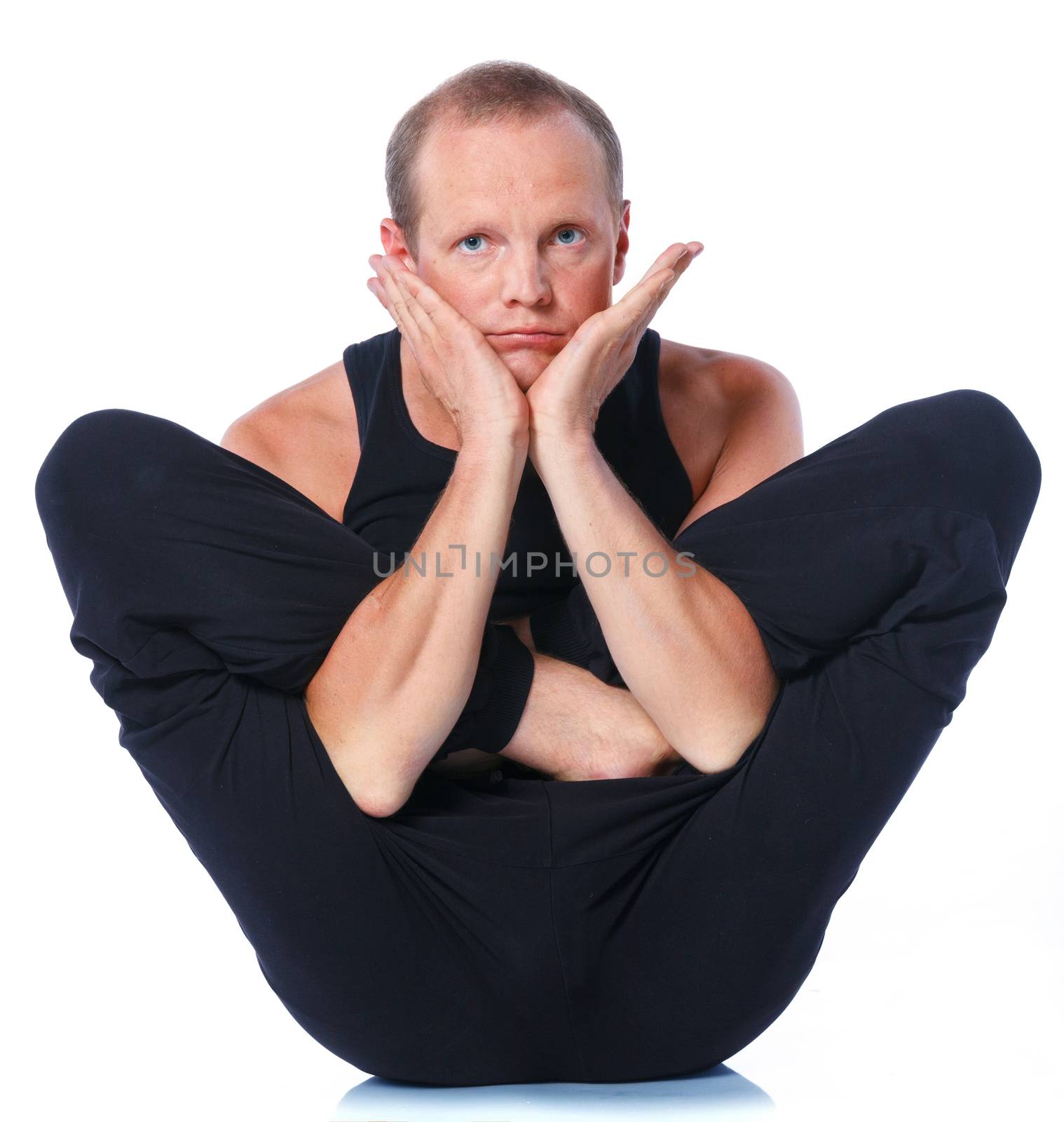 Young and handsome man doing yoga. Isolated on white backgraund