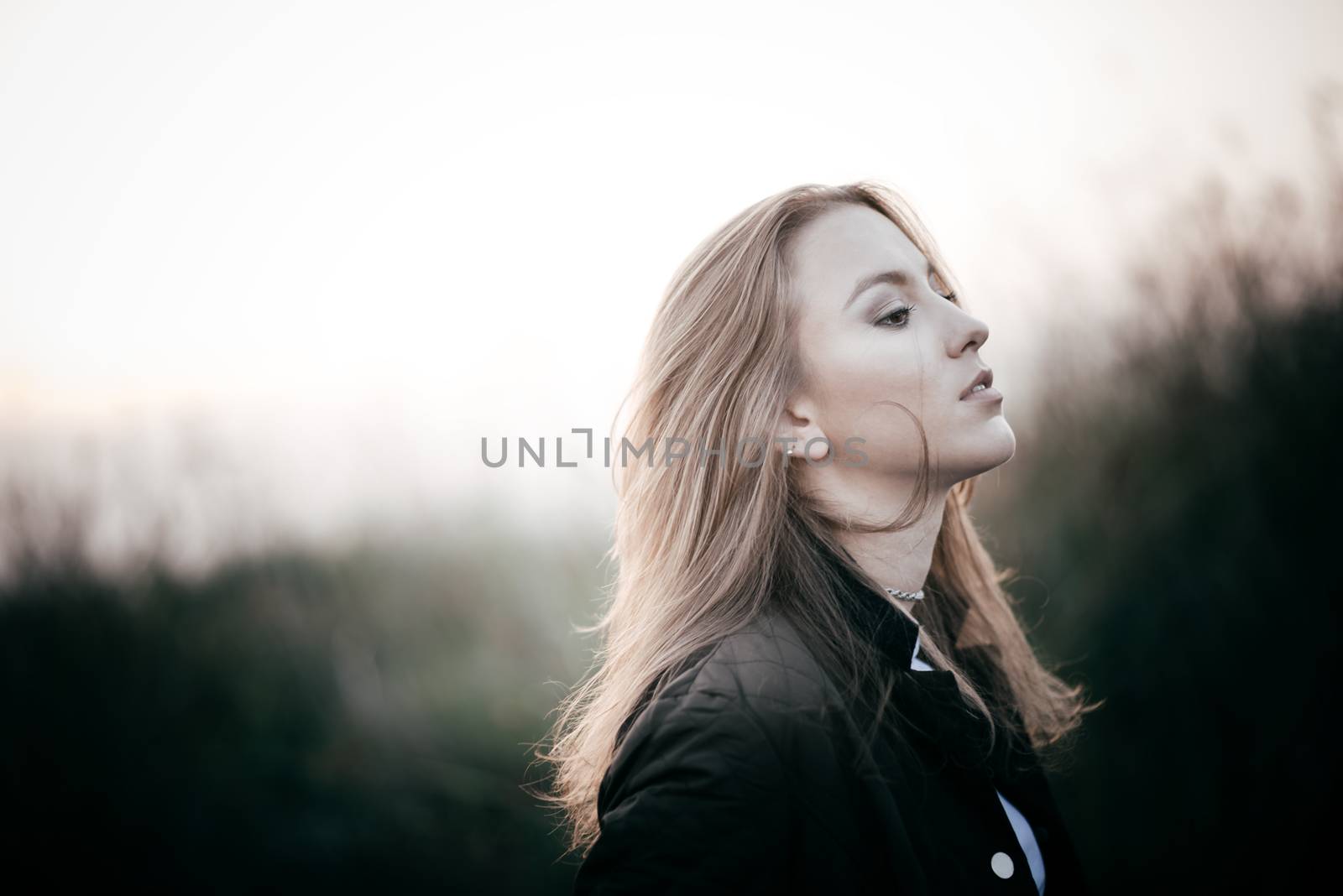 Brunette girl in late autumn moving away