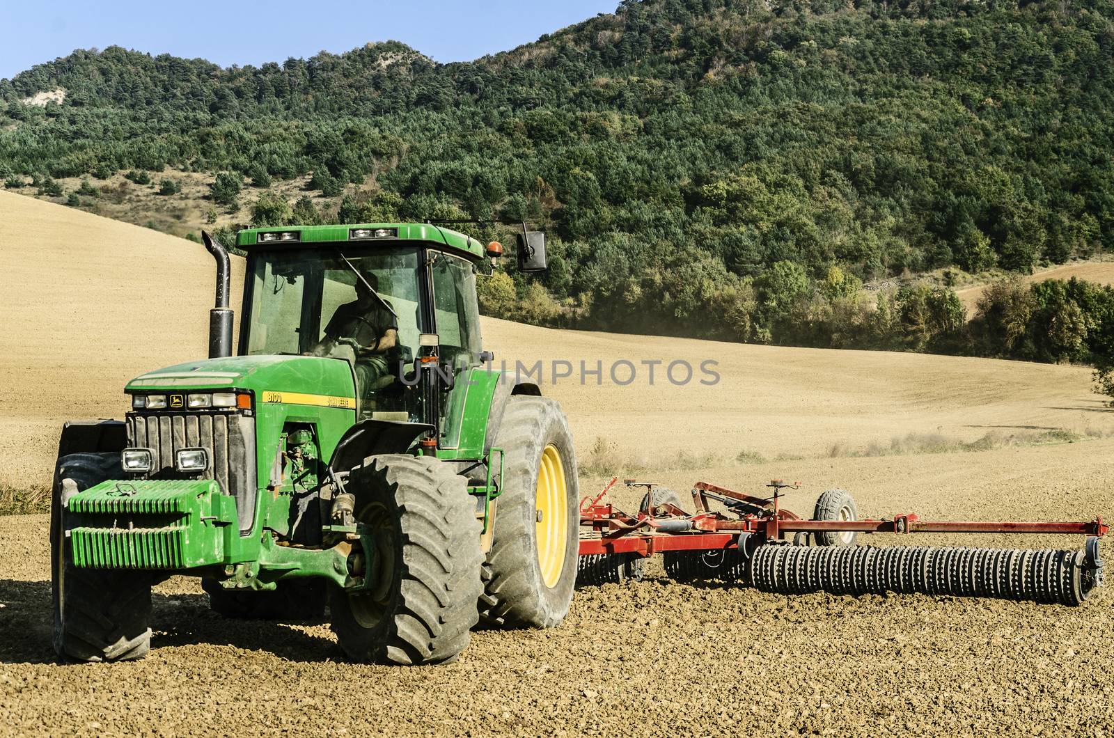Farmers working on their land in Navarra, Spain