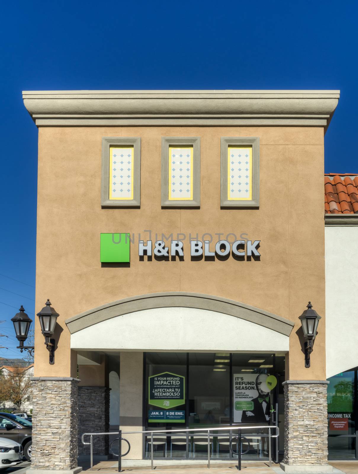 GRANADA HILLS, CA/USA - JANUARY 7, 2015: H & R Block Retail Exterior. H & R Block is a tax preparation company in the United States.