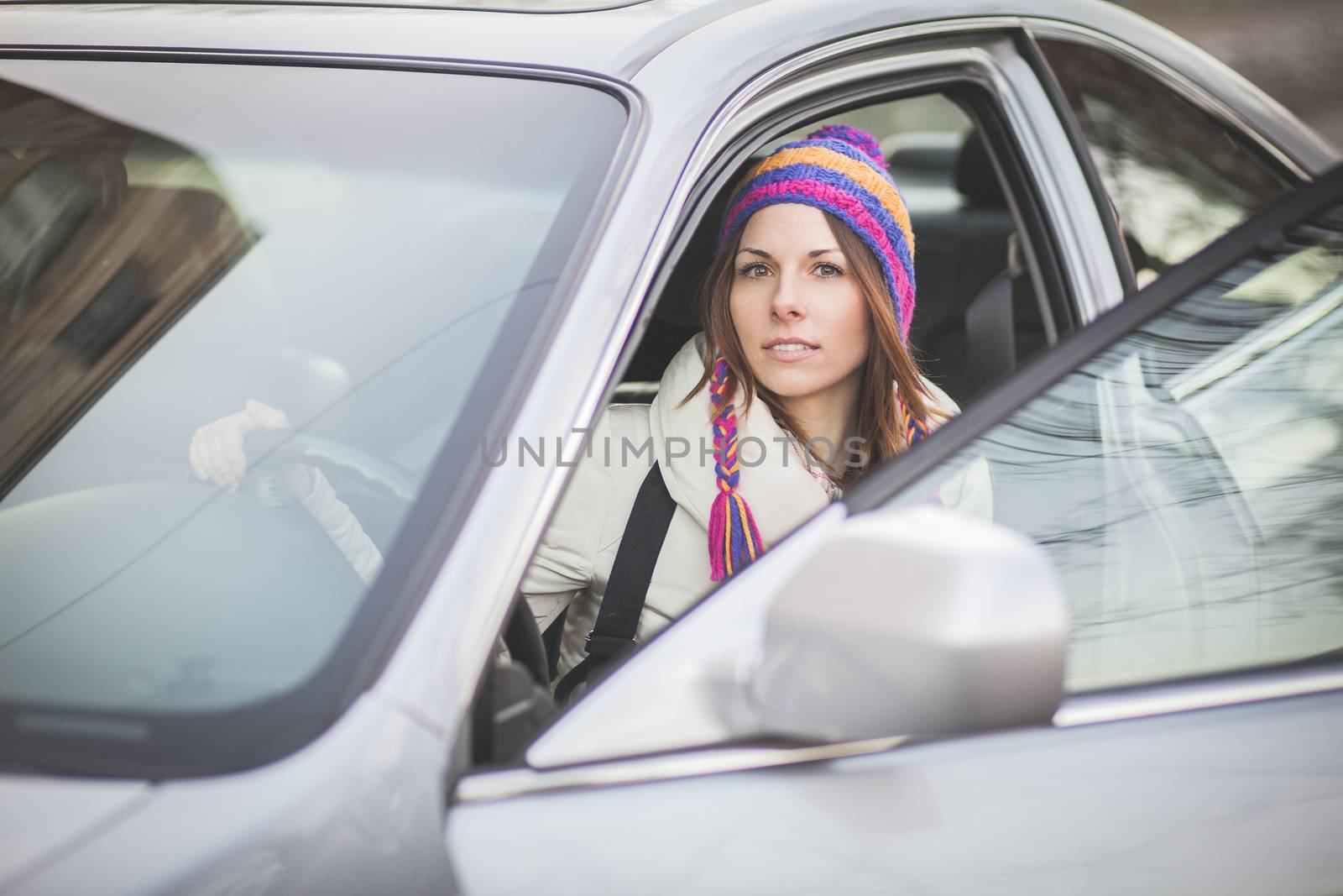 Young woman in a rental car by Kor