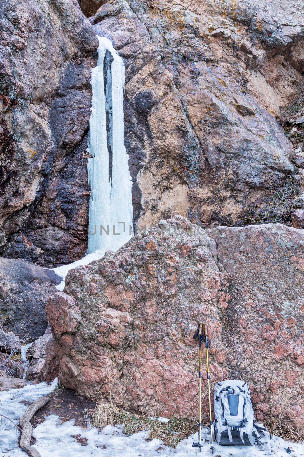 backpack and trekking poles at Horsetooth Waterfalls, a popular hiking destination near Fort Collins in northern Colorado, winter scenery