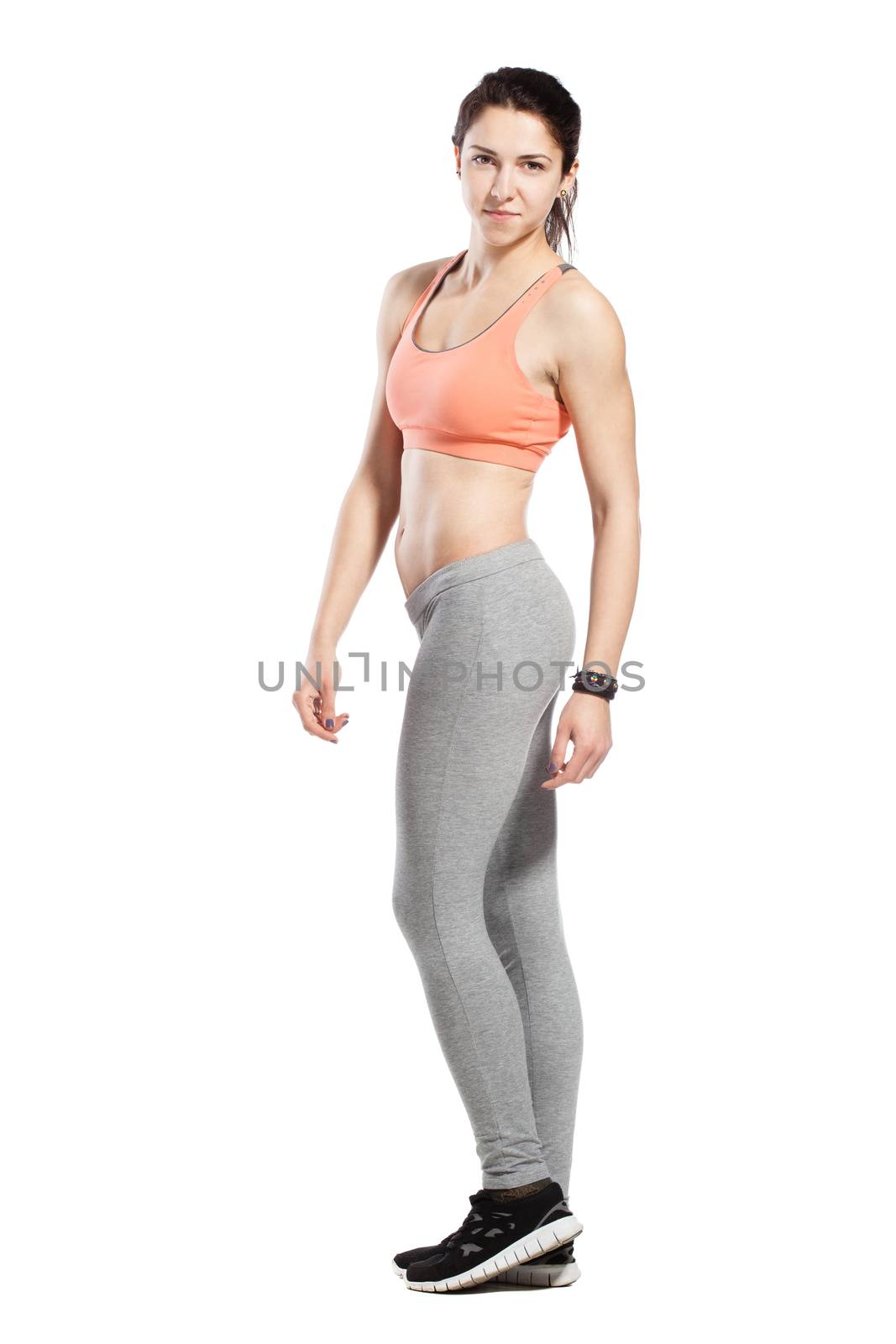 fitness girl posing against white background