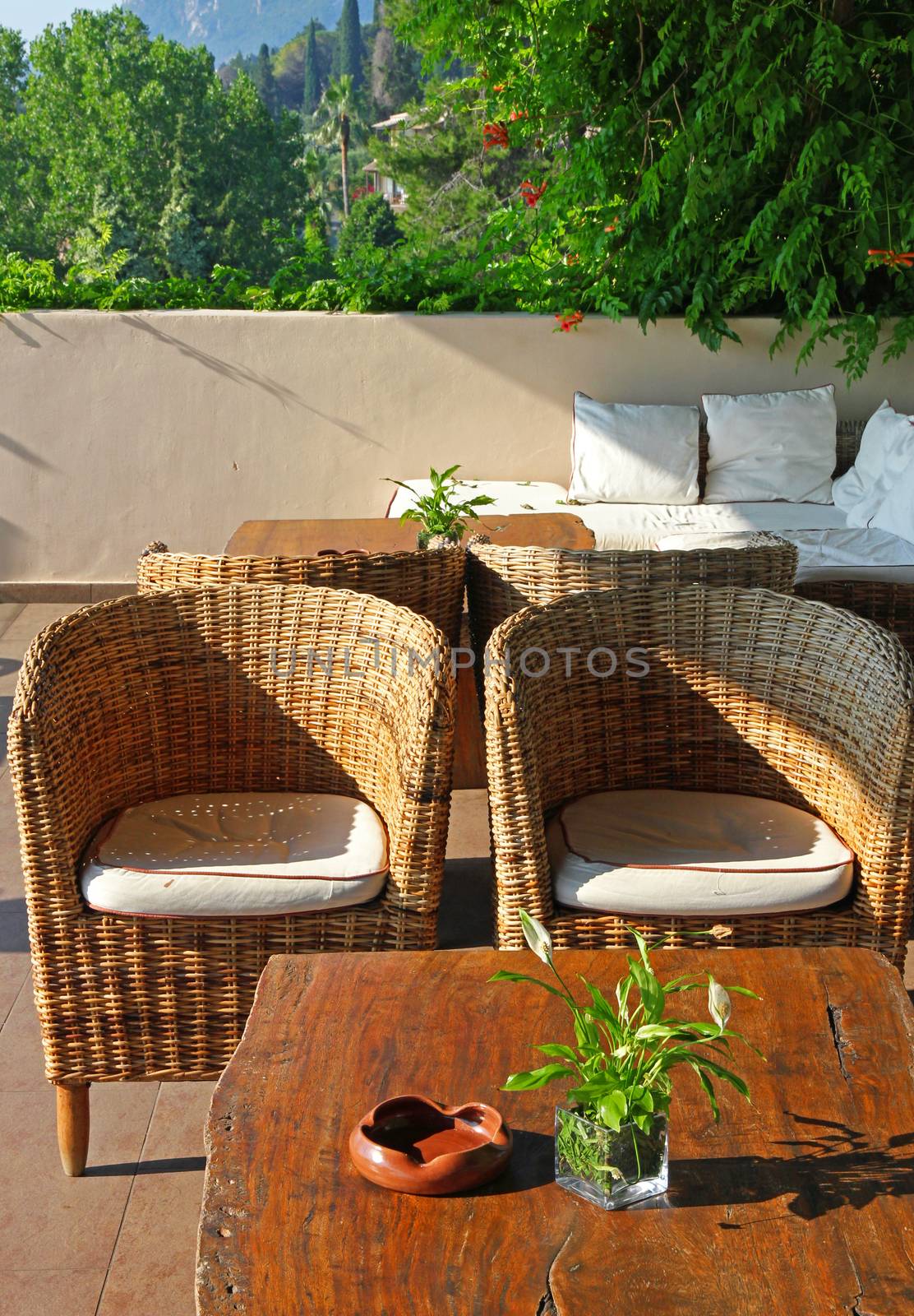Greece. Corfu island. An open-air cafe with table and chairs  