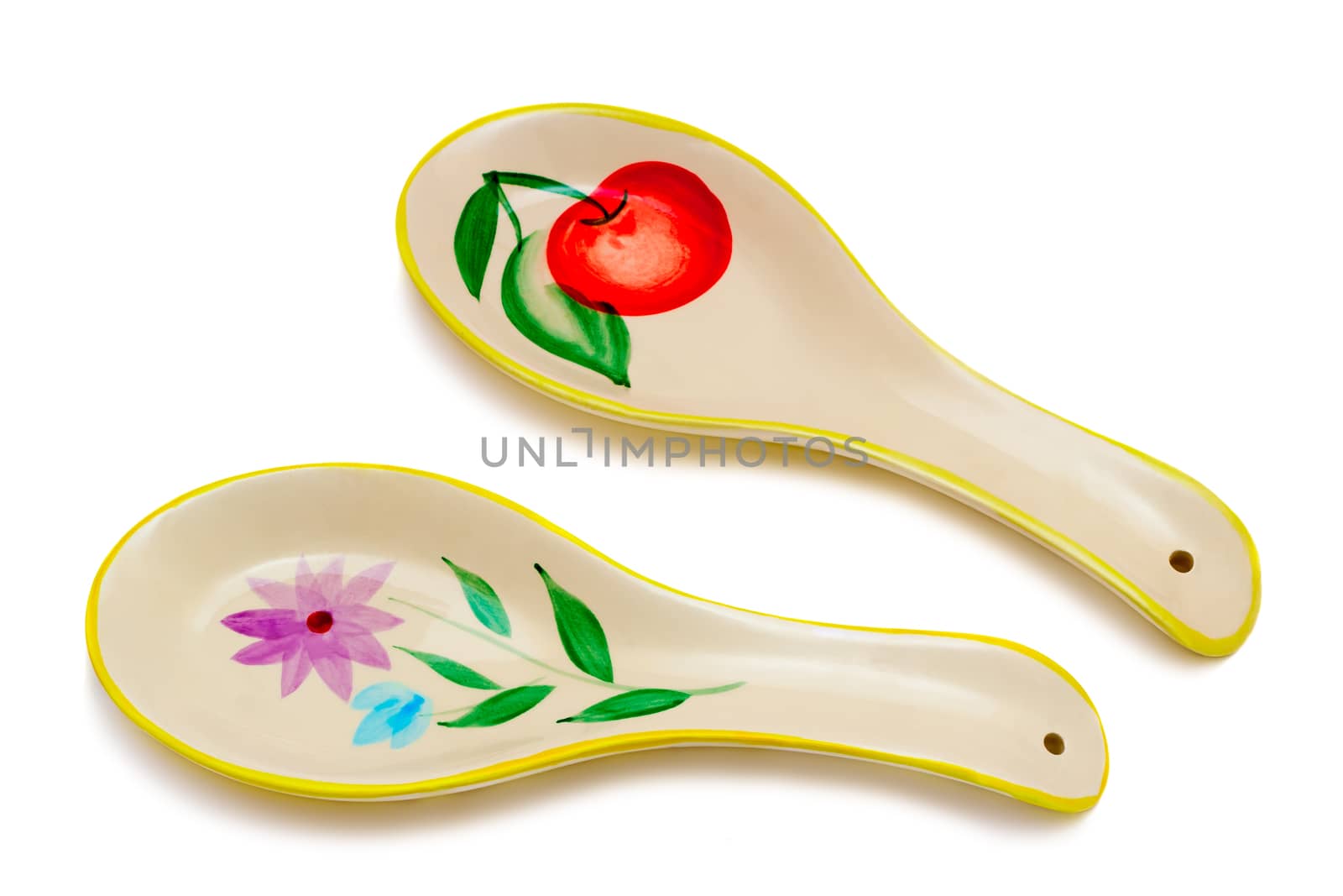 Two large ceramic spoon on a white background. by georgina198