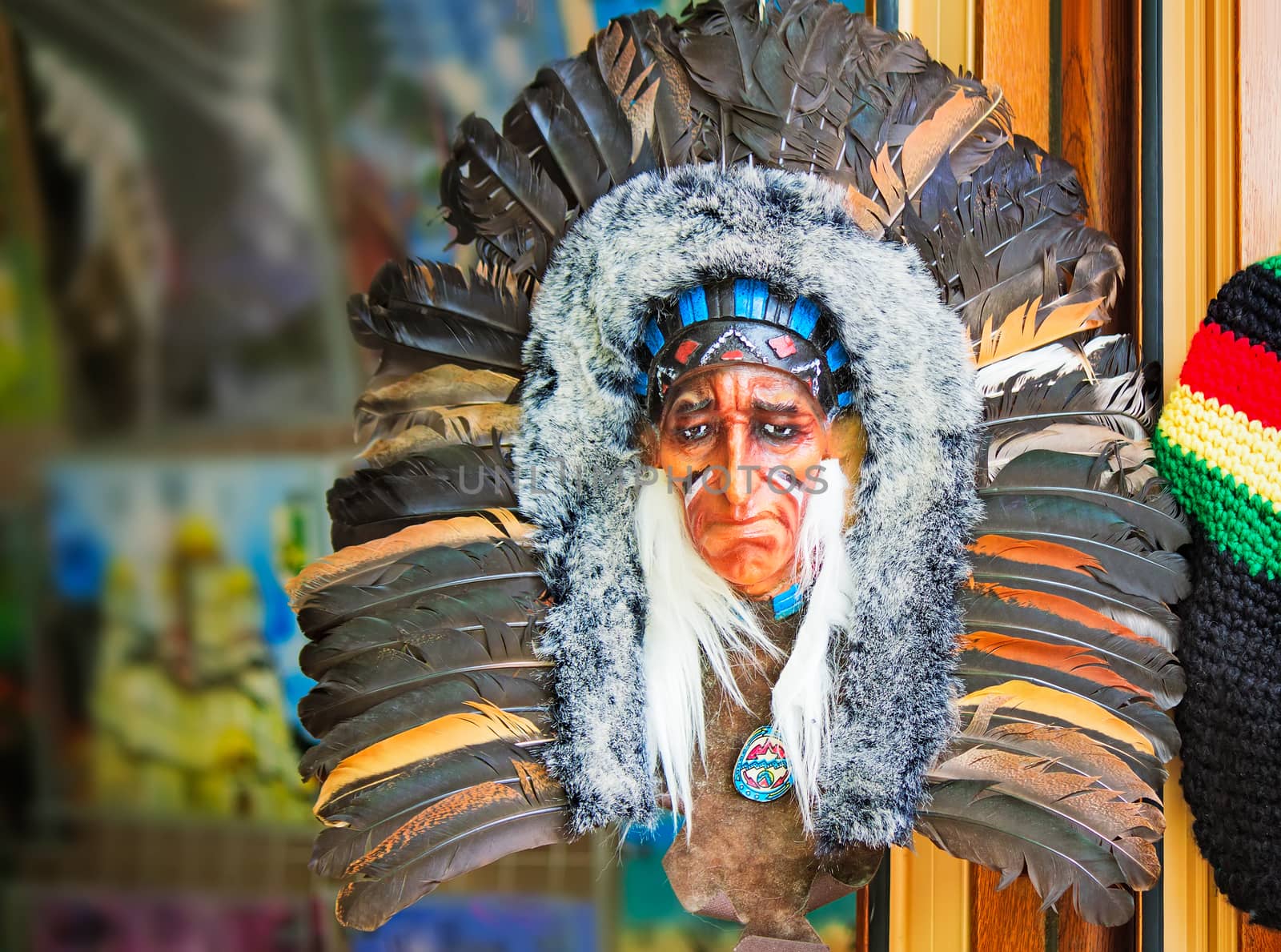 On the shop front is colorful souvenir: a beautiful mask Indians, decorated with fur and feathers.