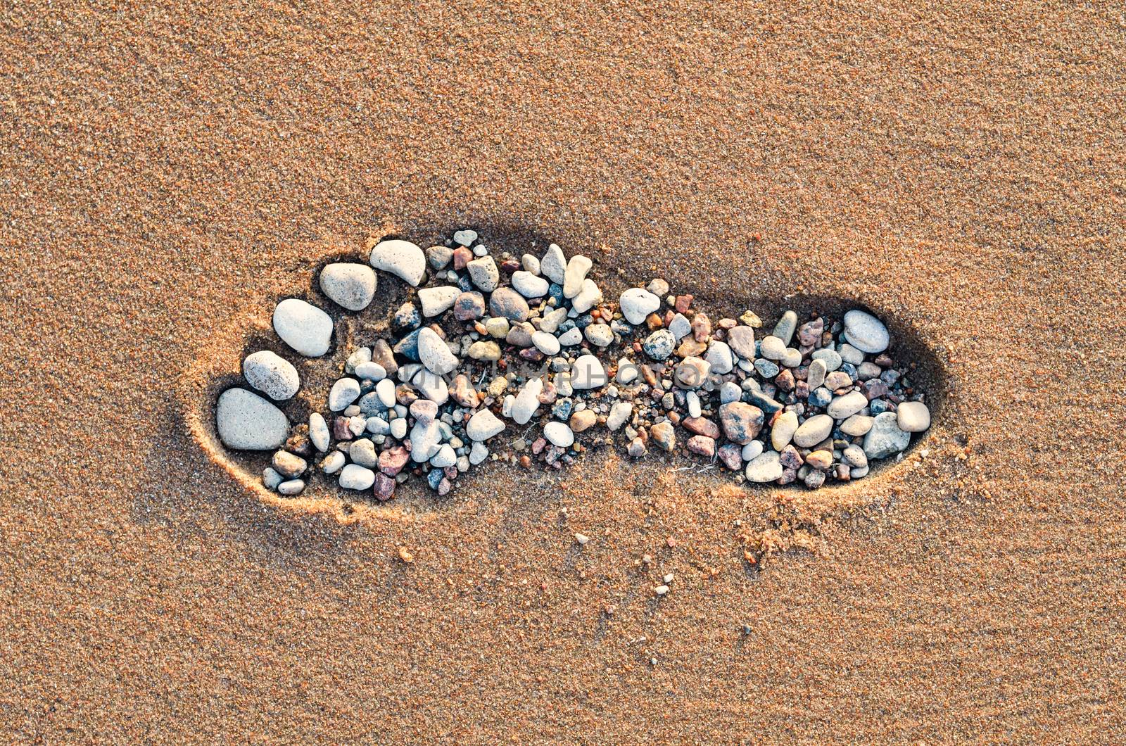 Footstep on sandy beach by styf22