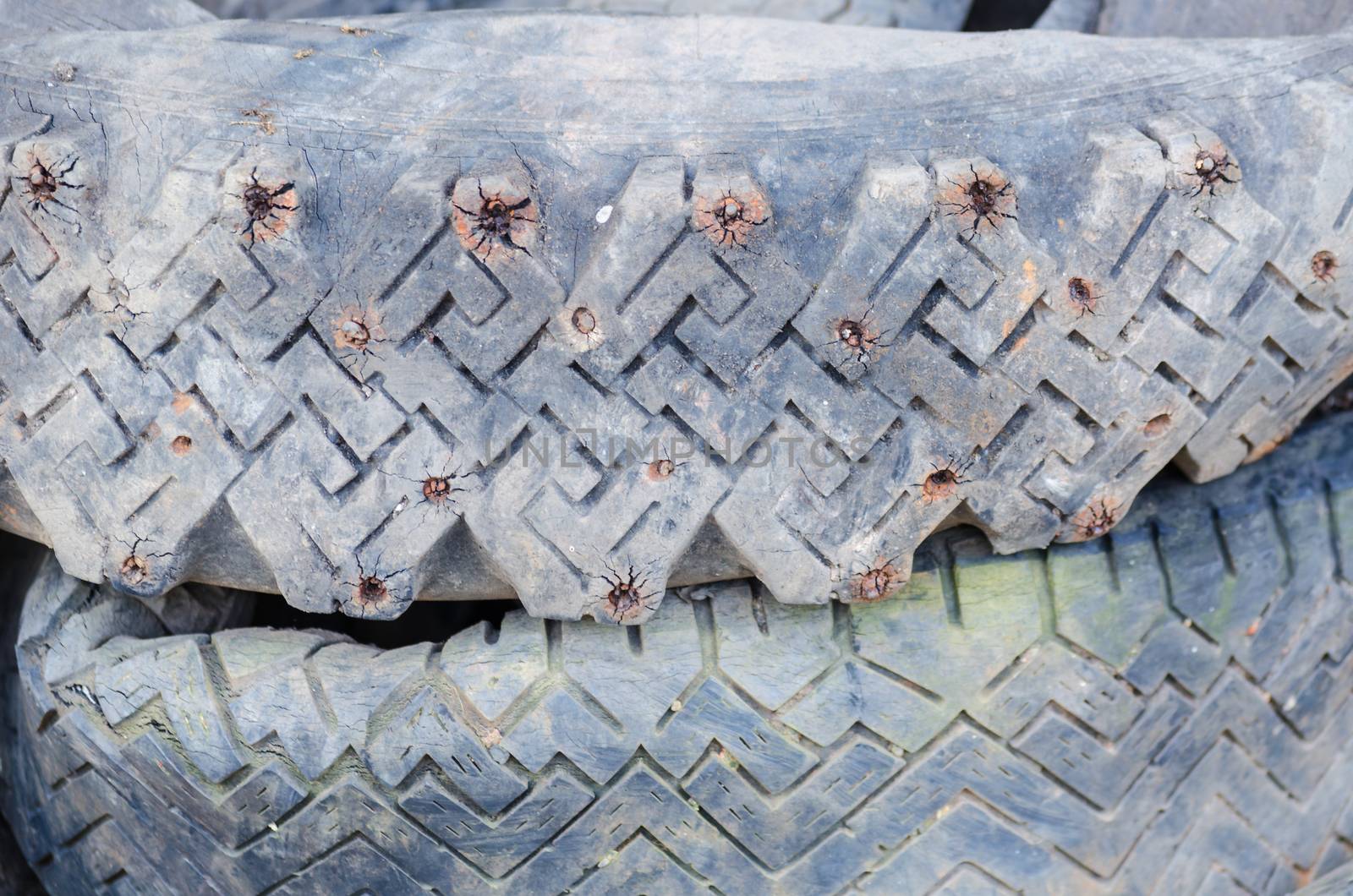 A stack of old studded tires. The use of studded tires is not allowed in Germany.