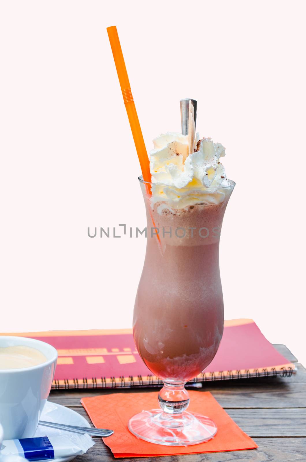 Iced coffee with cream and waffle on a white background.