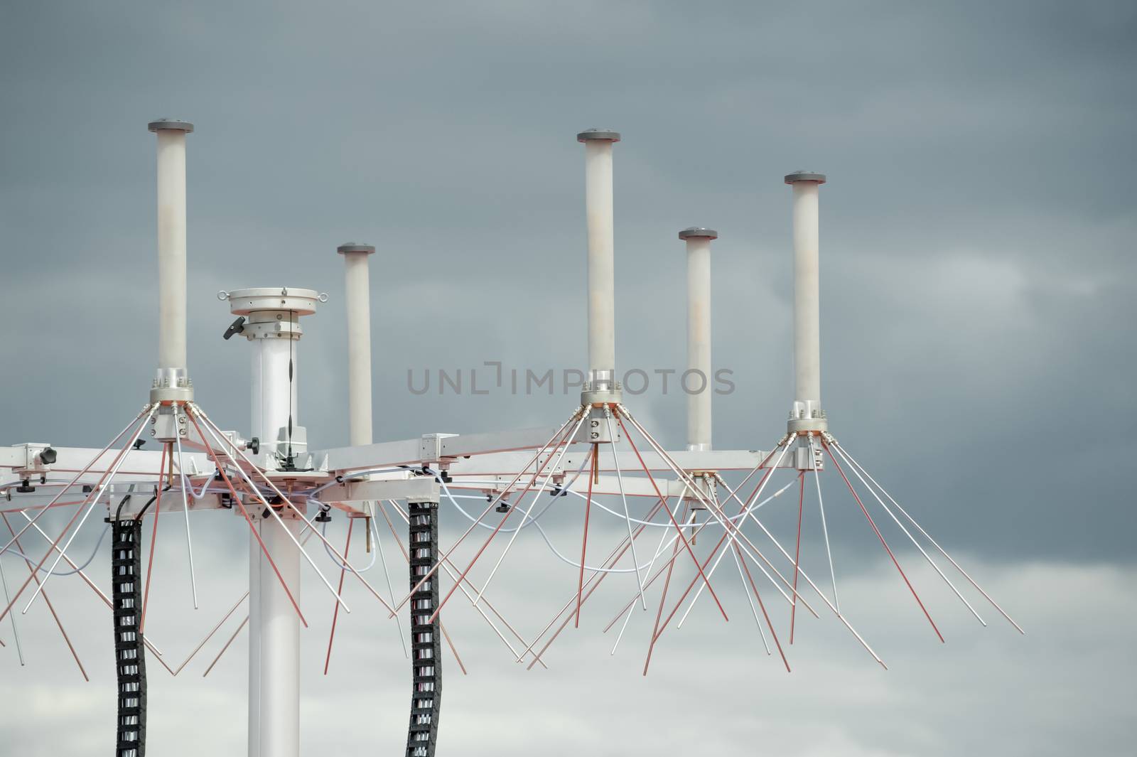 aviation radar system closeup with rain clouds in the background