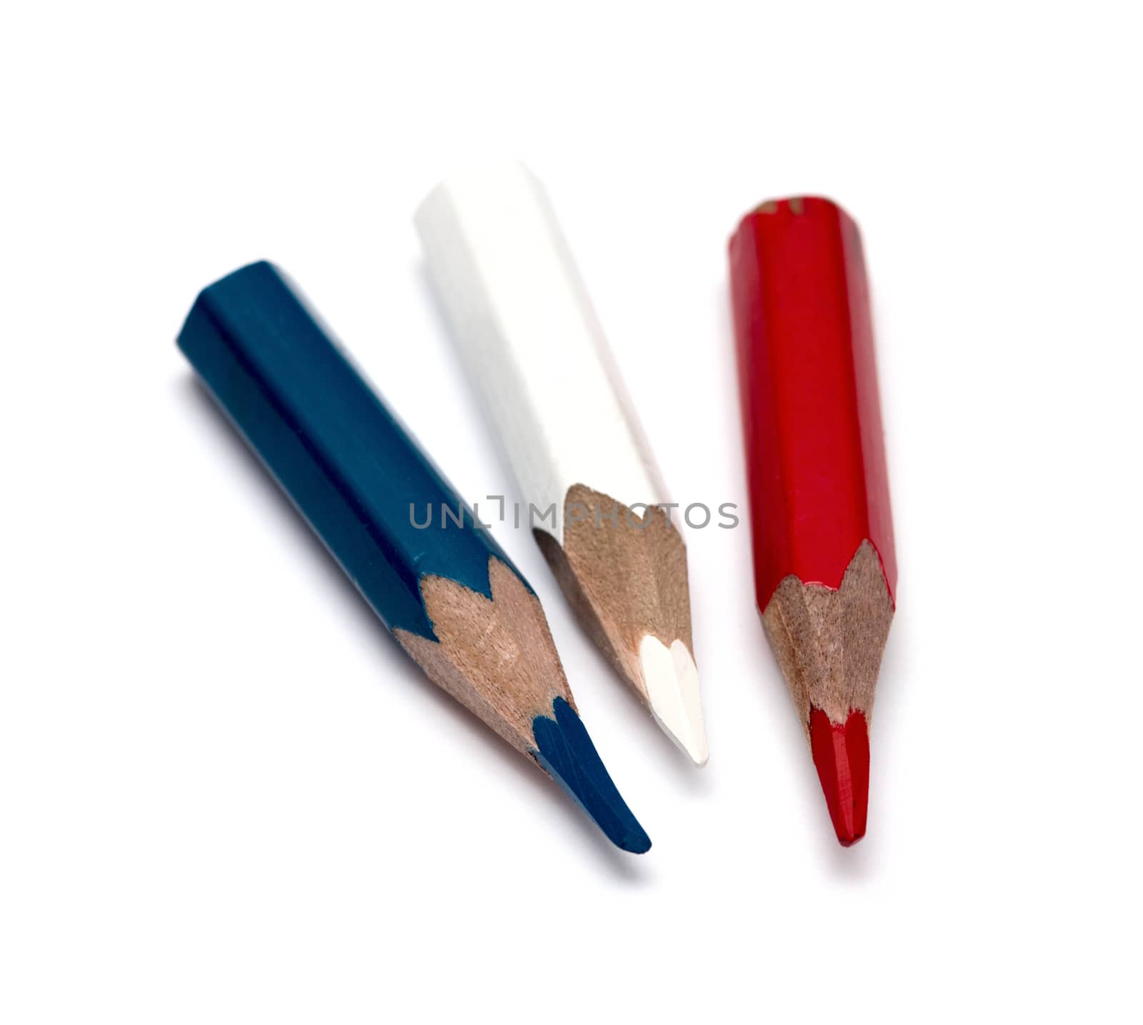 Three small used colored pencils