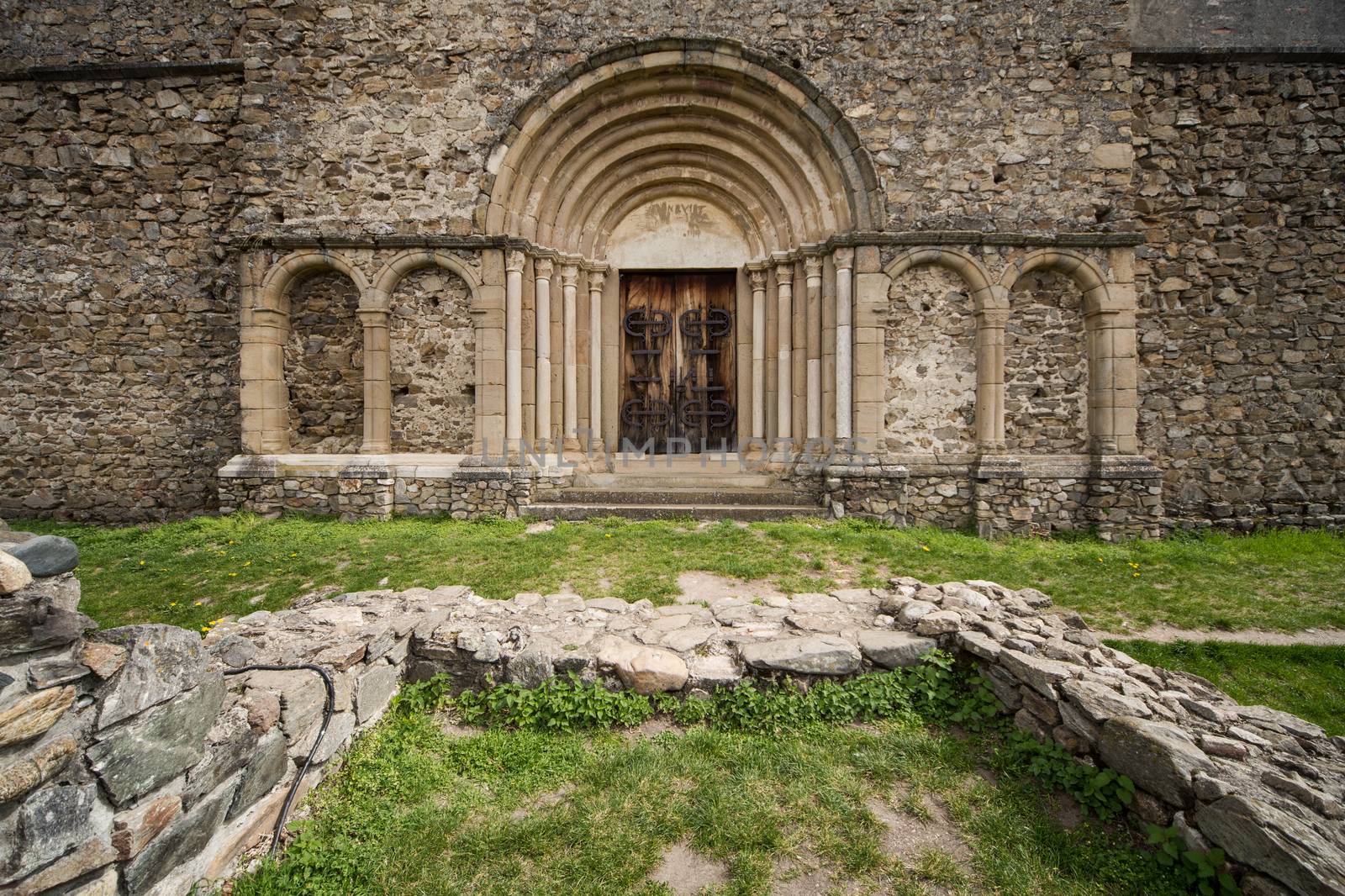 Romanesque church entrance. Cisnadioara, Romania