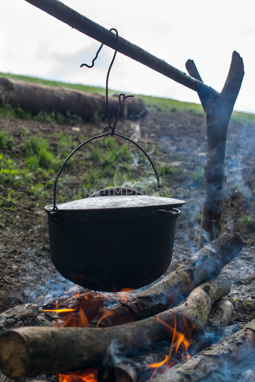Cooking in the cauldron on the open fire.