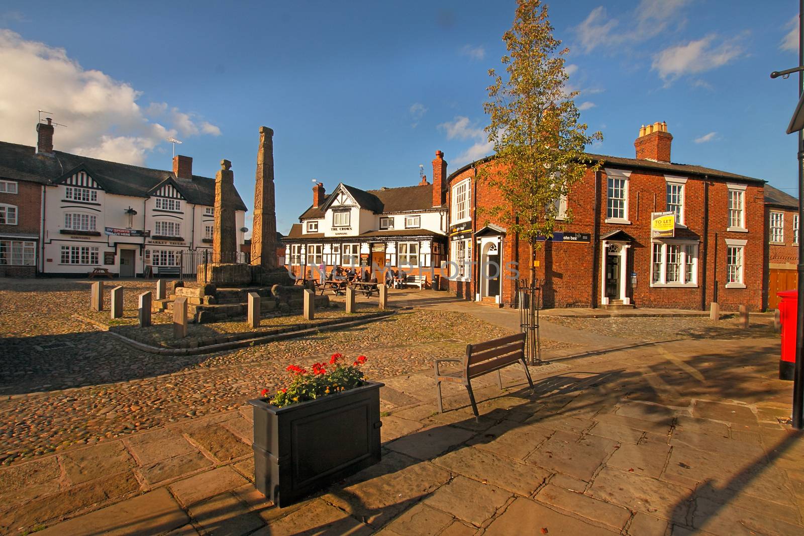 Two ninth century Anglo-Saxon crosses stand in the market square at Sandbach in Cheshire, England.