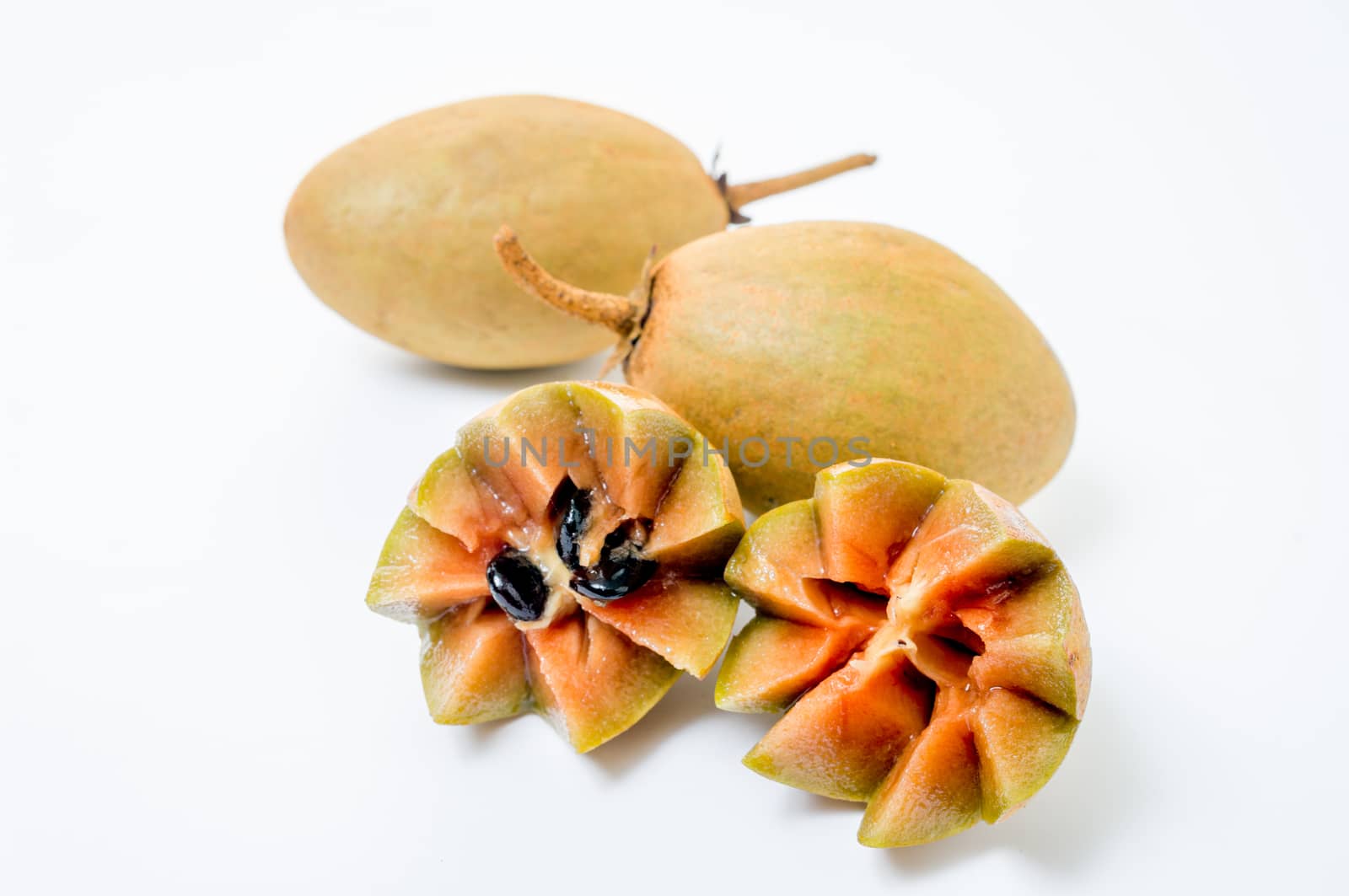 Fresh sapodillas isolated on white background