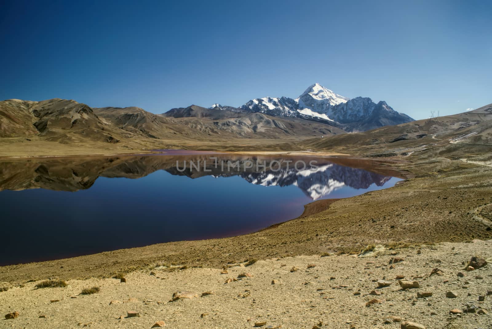 Scenic lake with Huayna Potosi mountain in the background, peak in Bolivian Andes