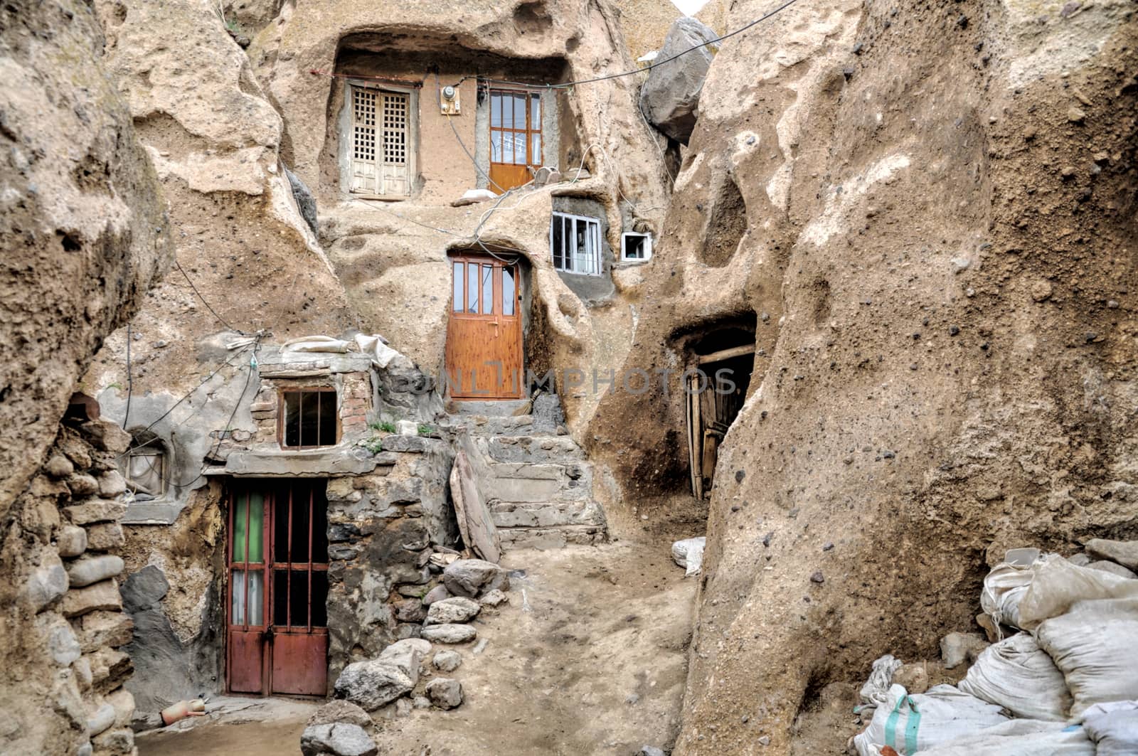 Facade of houses excavated in rock cones in Kandovan village in Iran