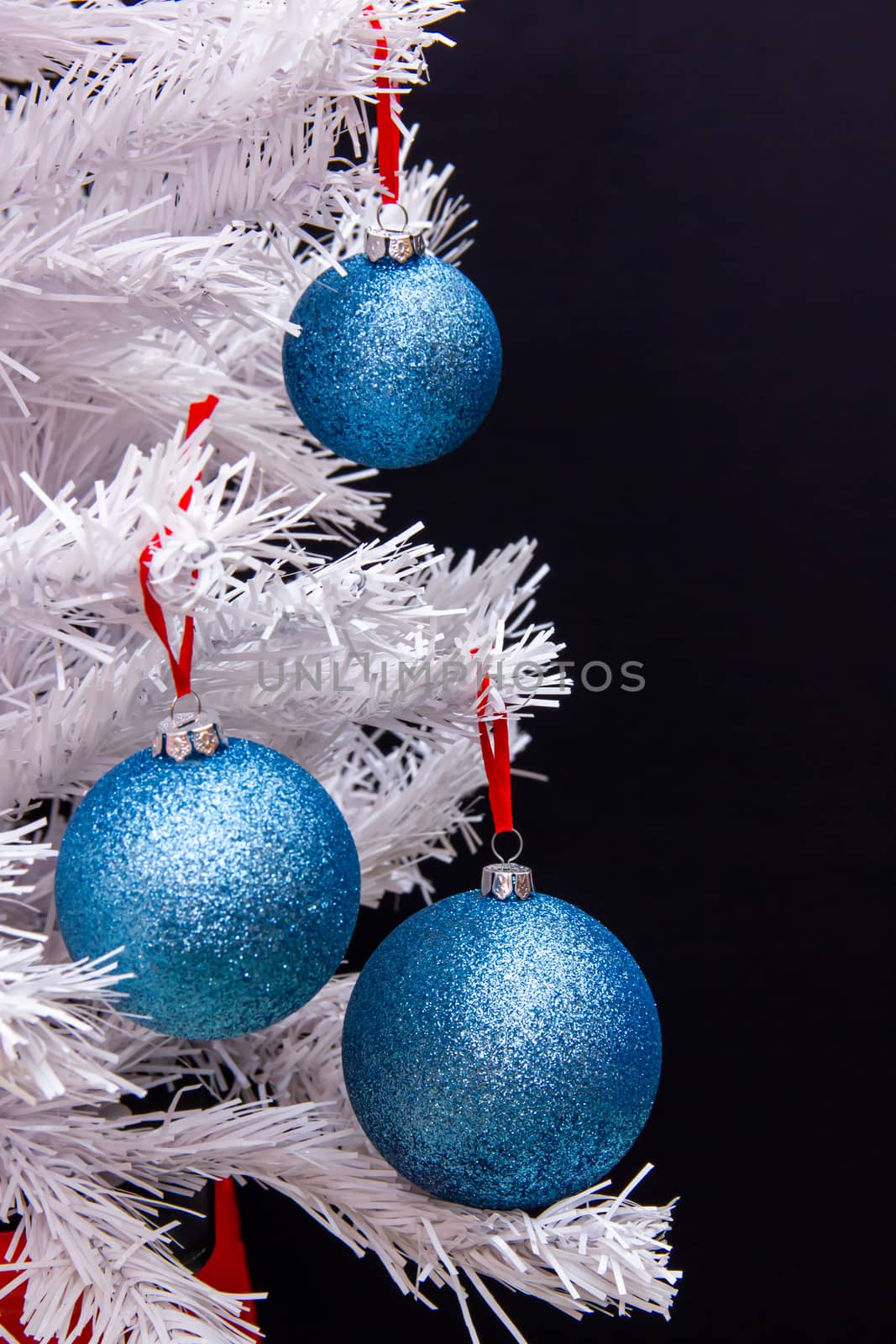 Christmas balls on tree with white branches