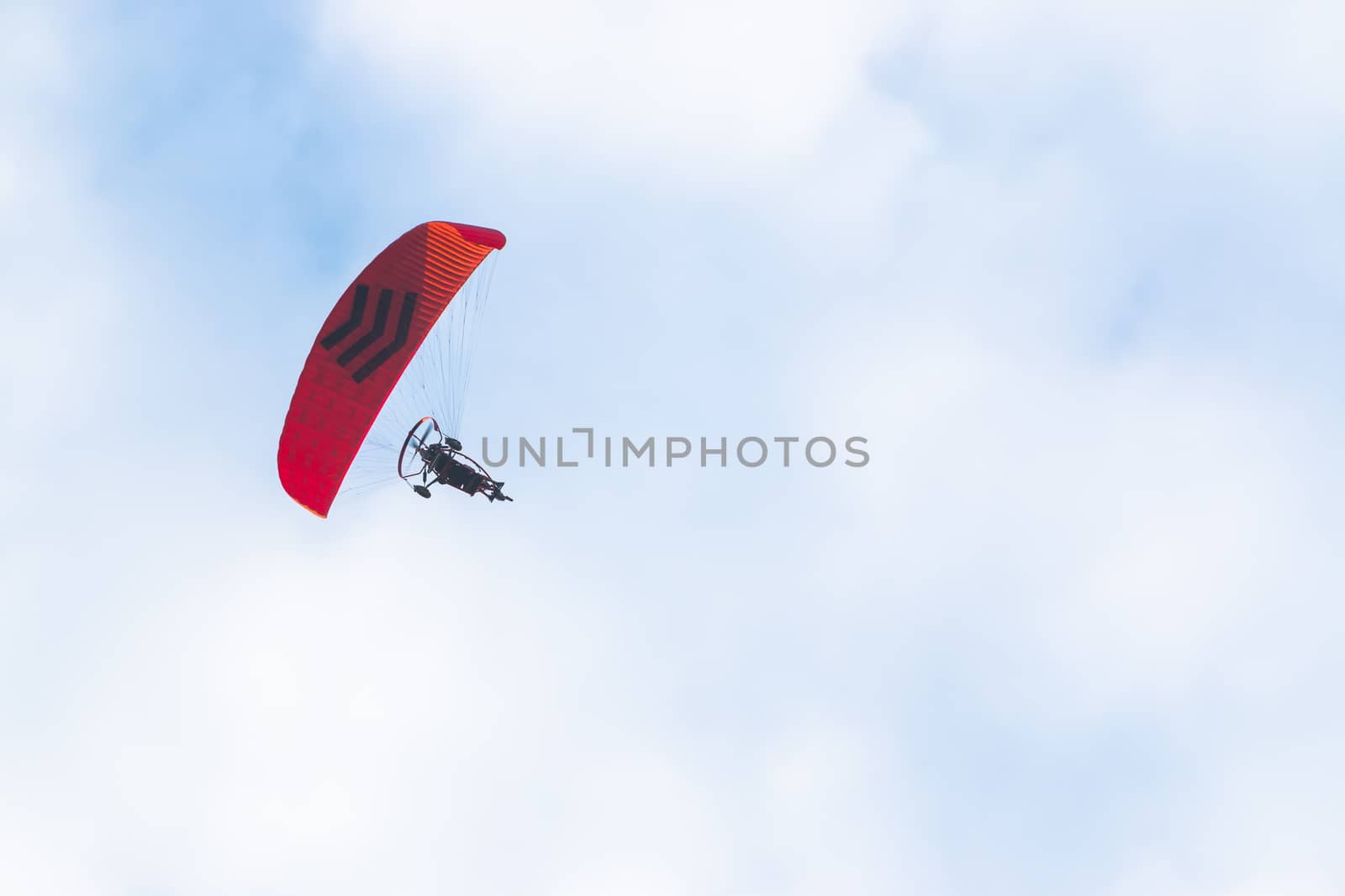 Paramotor in the blue sky