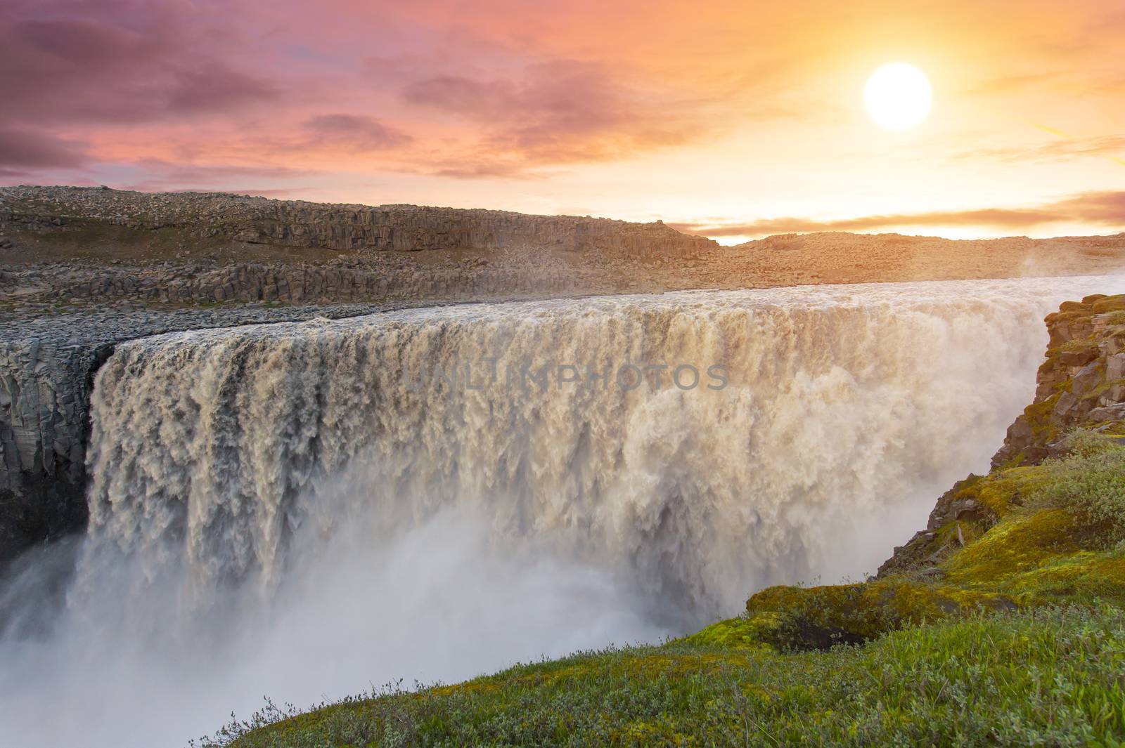 Sunset over, Dettifoss the most powerful waterfall on Iceland and in the whole Europe. It is located in Jokulsargljufur National Park the northeasten Iceland 