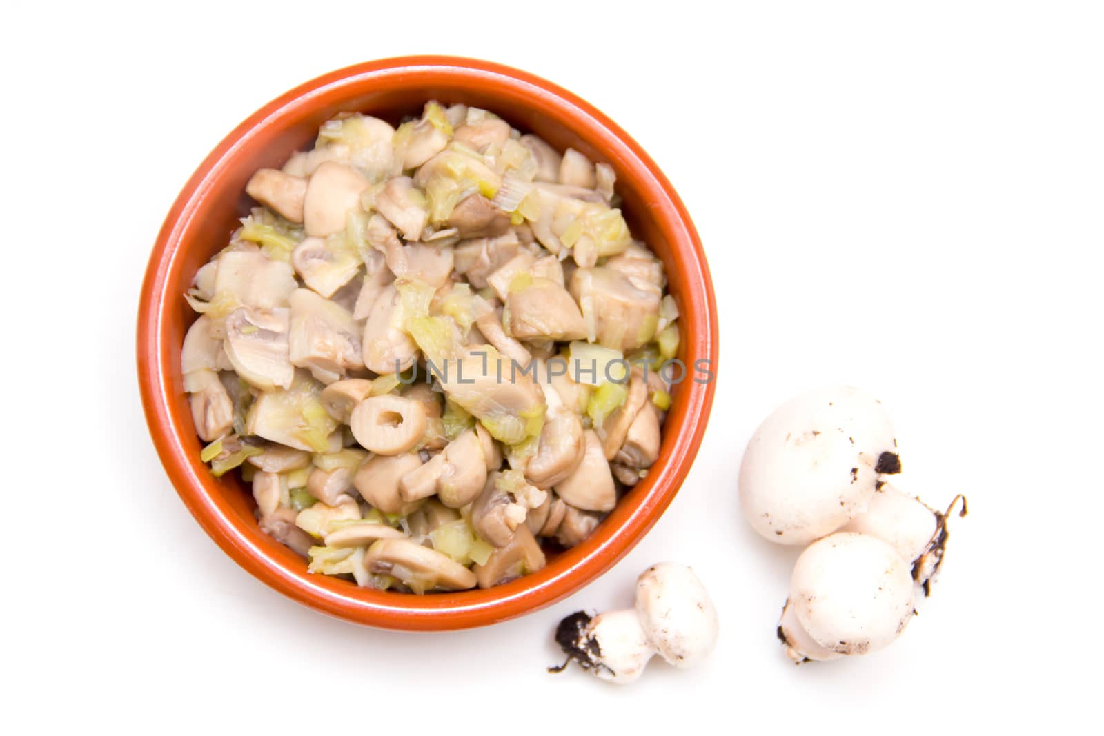 Grilled Mushrooms on bowl on white background seen from above