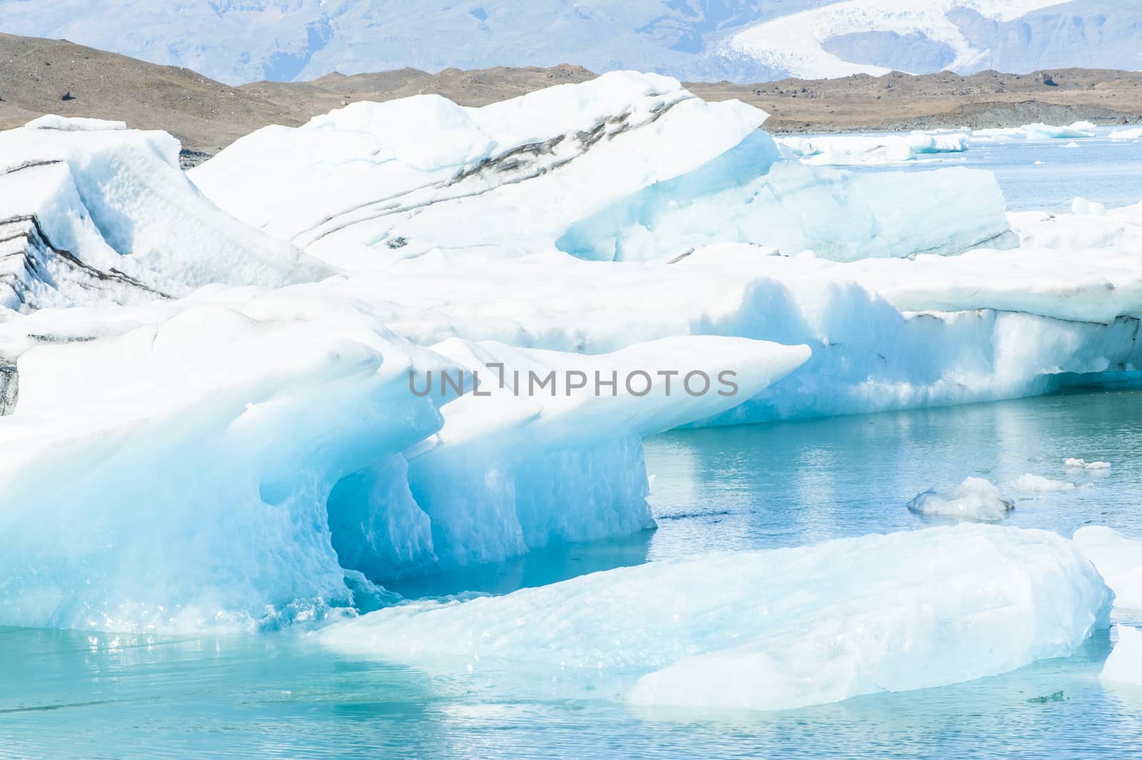 Detailed photo of the Icelandic glacier iceberg in a ice lagoon with incredibly vivid colors and a nice texture