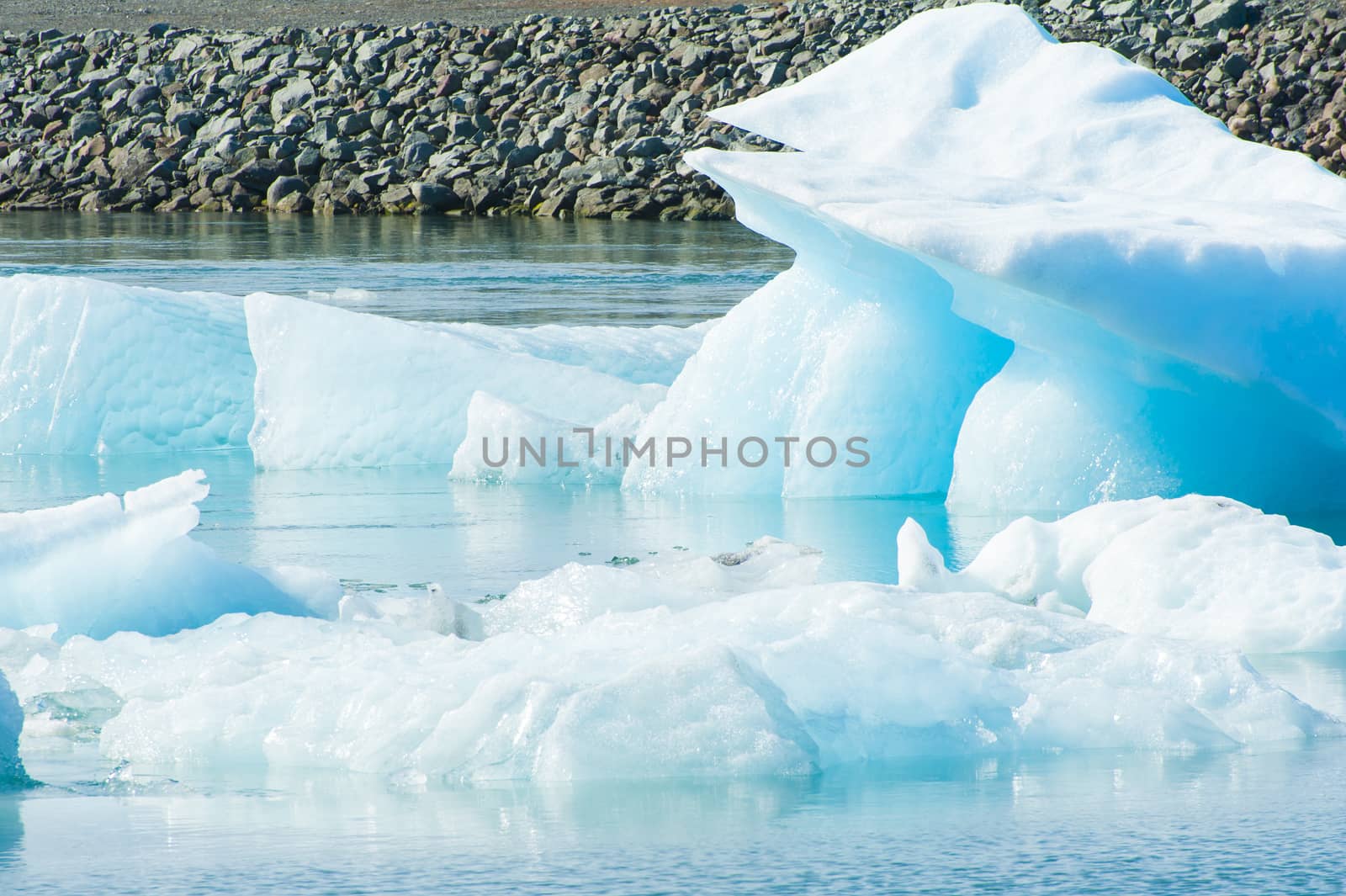 Detailed photo of the Icelandic glacier iceberg in a ice lagoon with incredibly vivid colors and a nice texture