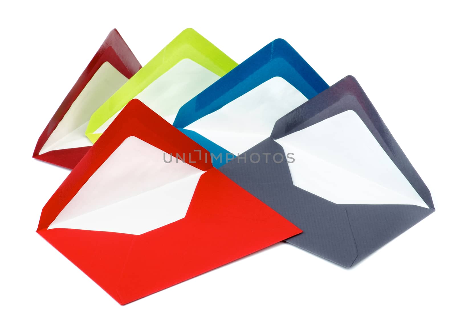 Arrangement of Five Colored Paper Envelopes isolated on white background