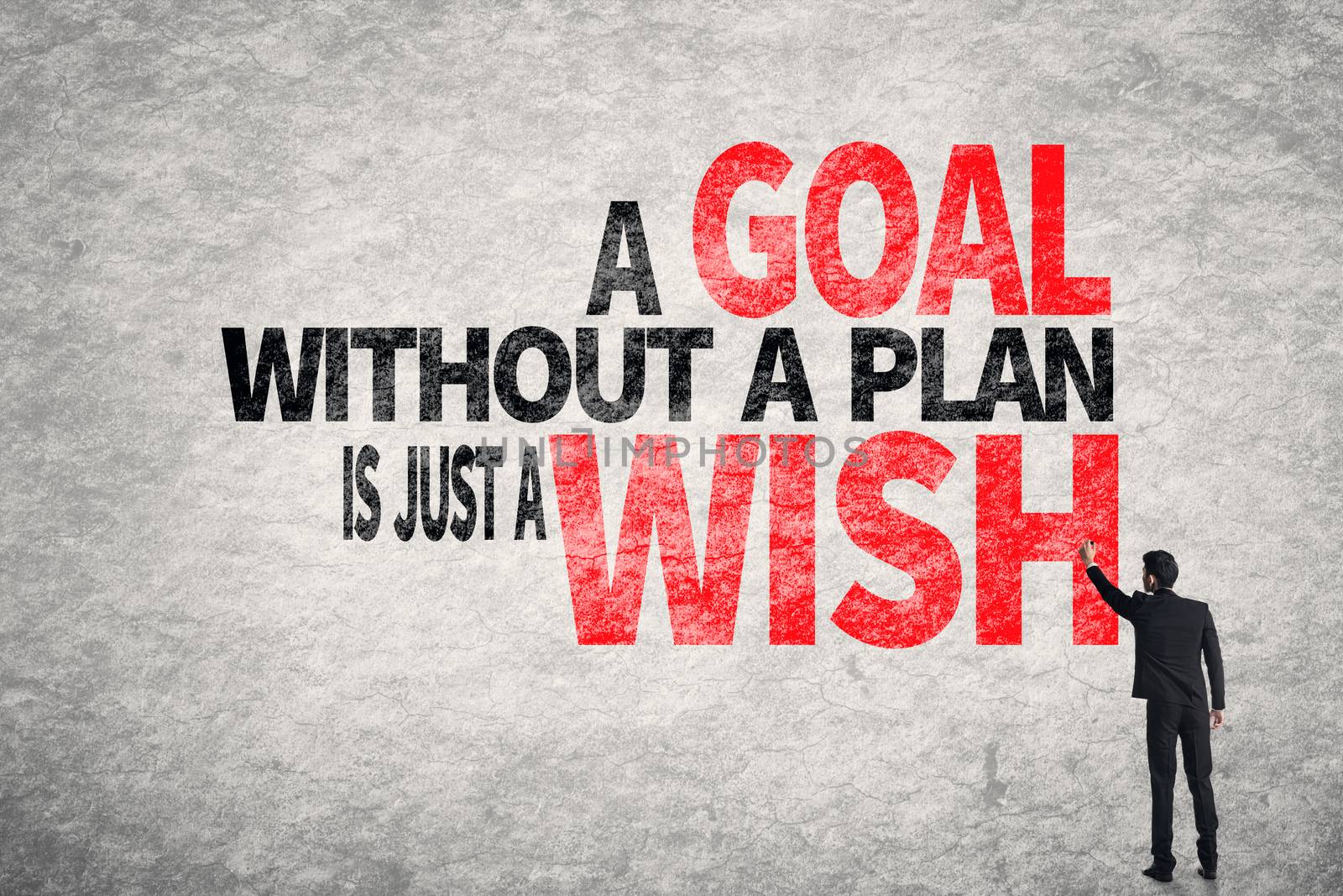 Asian business man write words on wall, A Goal without a Plan is Just a Wish