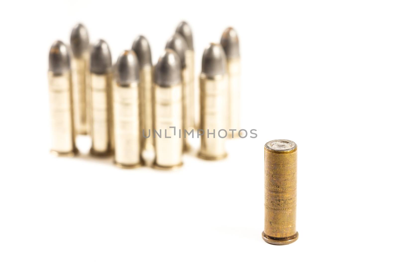 Think different (group of bullets and single bullet on white background)