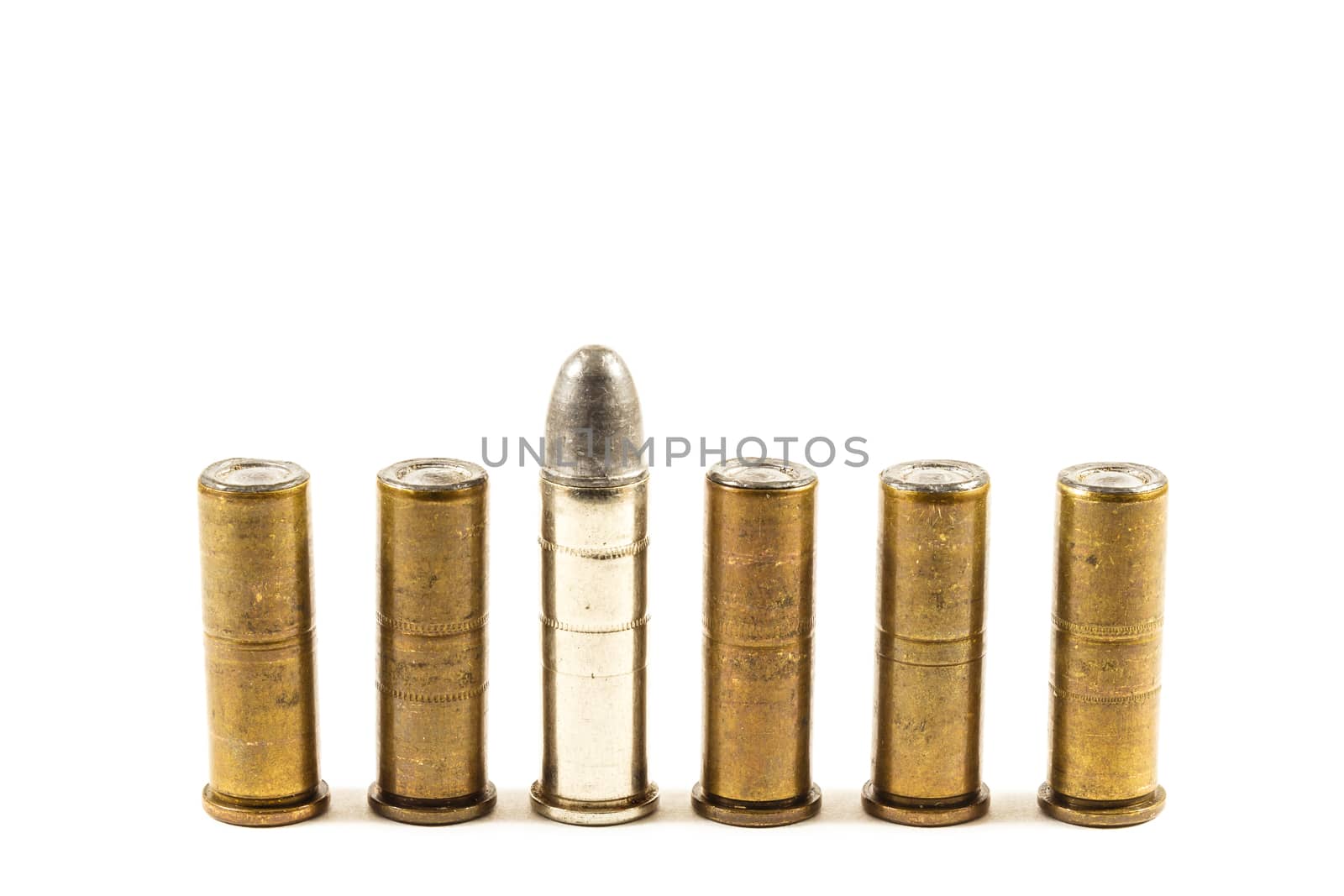 group of revolver's bullets on white background (isolated) and blank area at upper side