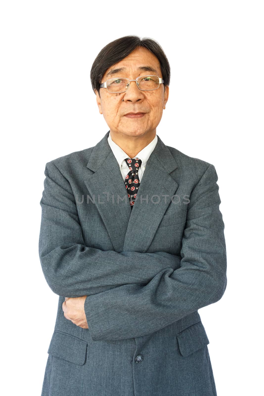 old aged thai businessman with glasses is standing and looking by stockdevil