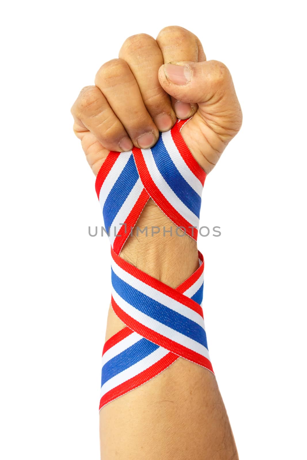 thai man fist and bind thai flag pattern ribbon on forearm on white background(isolated)