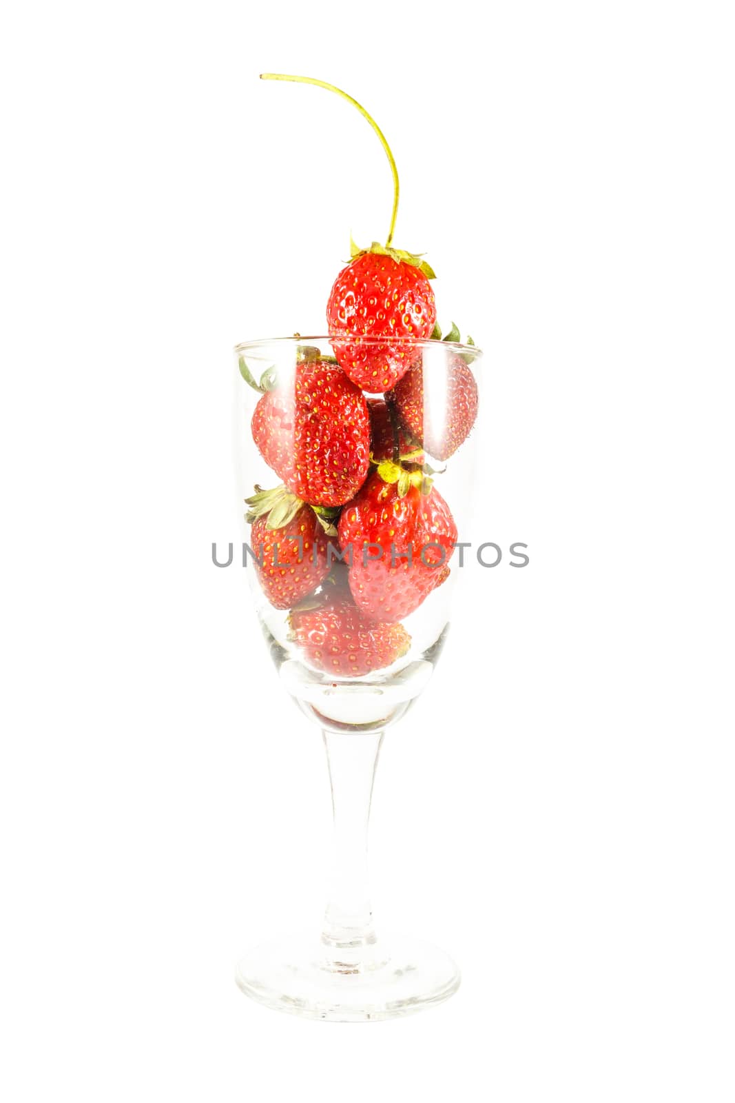 Strawberries in wine glass on white background (isolated)