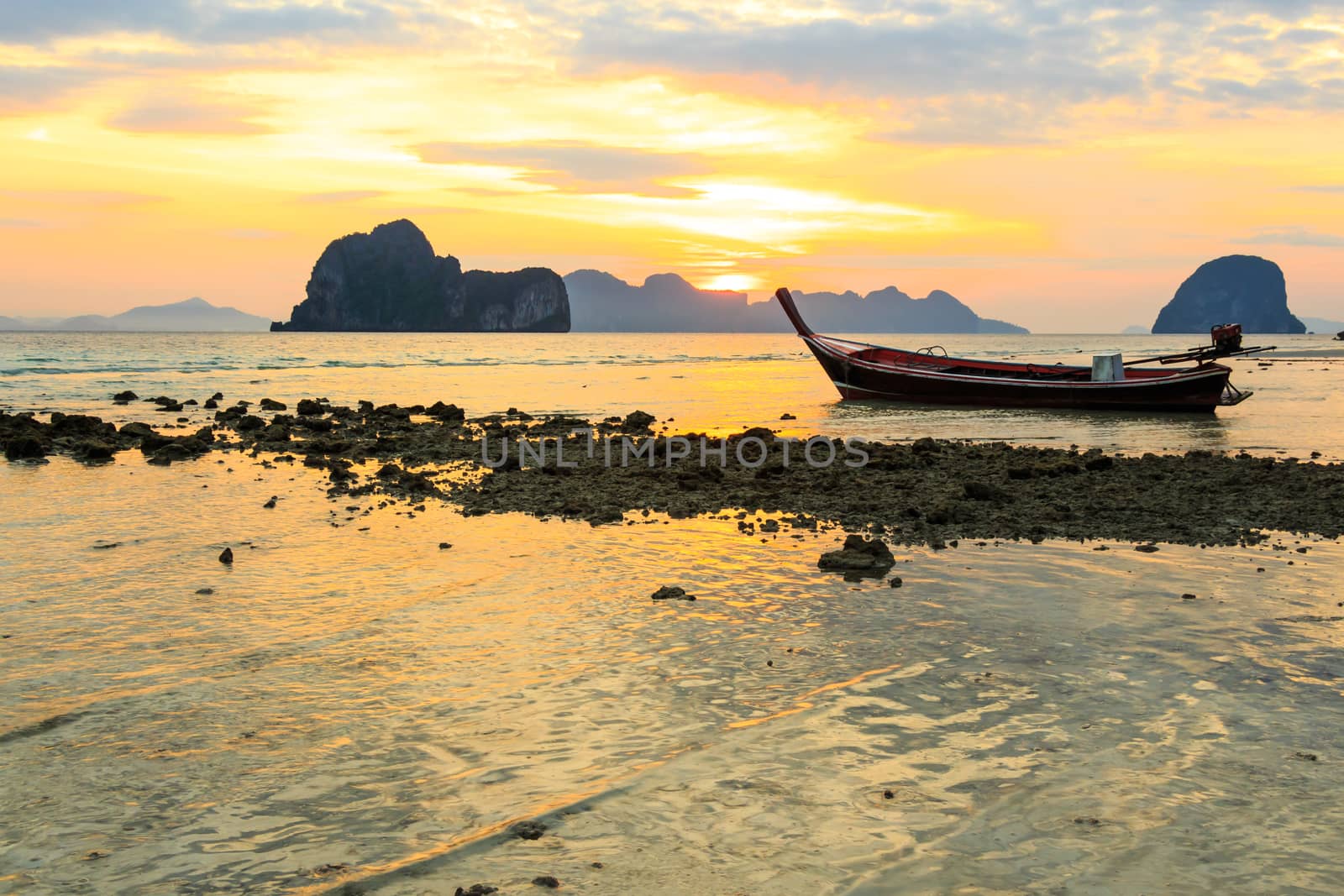 boat on beach and sunrise by stockdevil