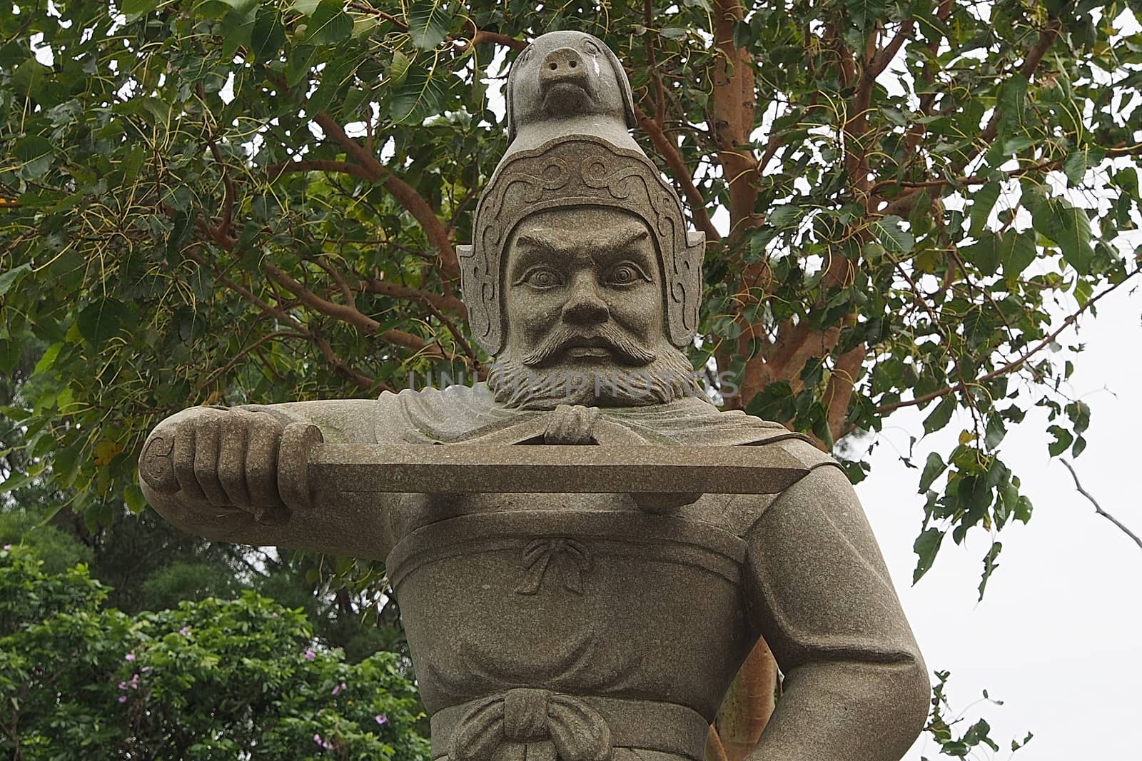 Statue warrior holding a sword.