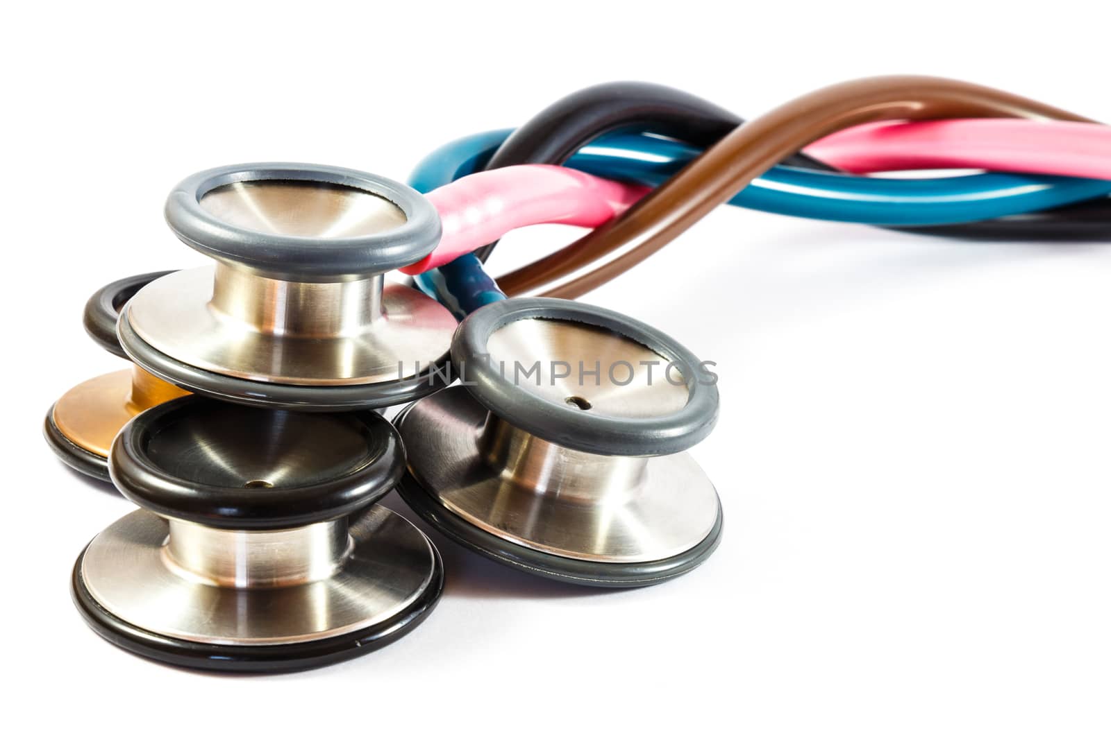 twist colorful stethoscopes on white background(isolated) and blank area at right side