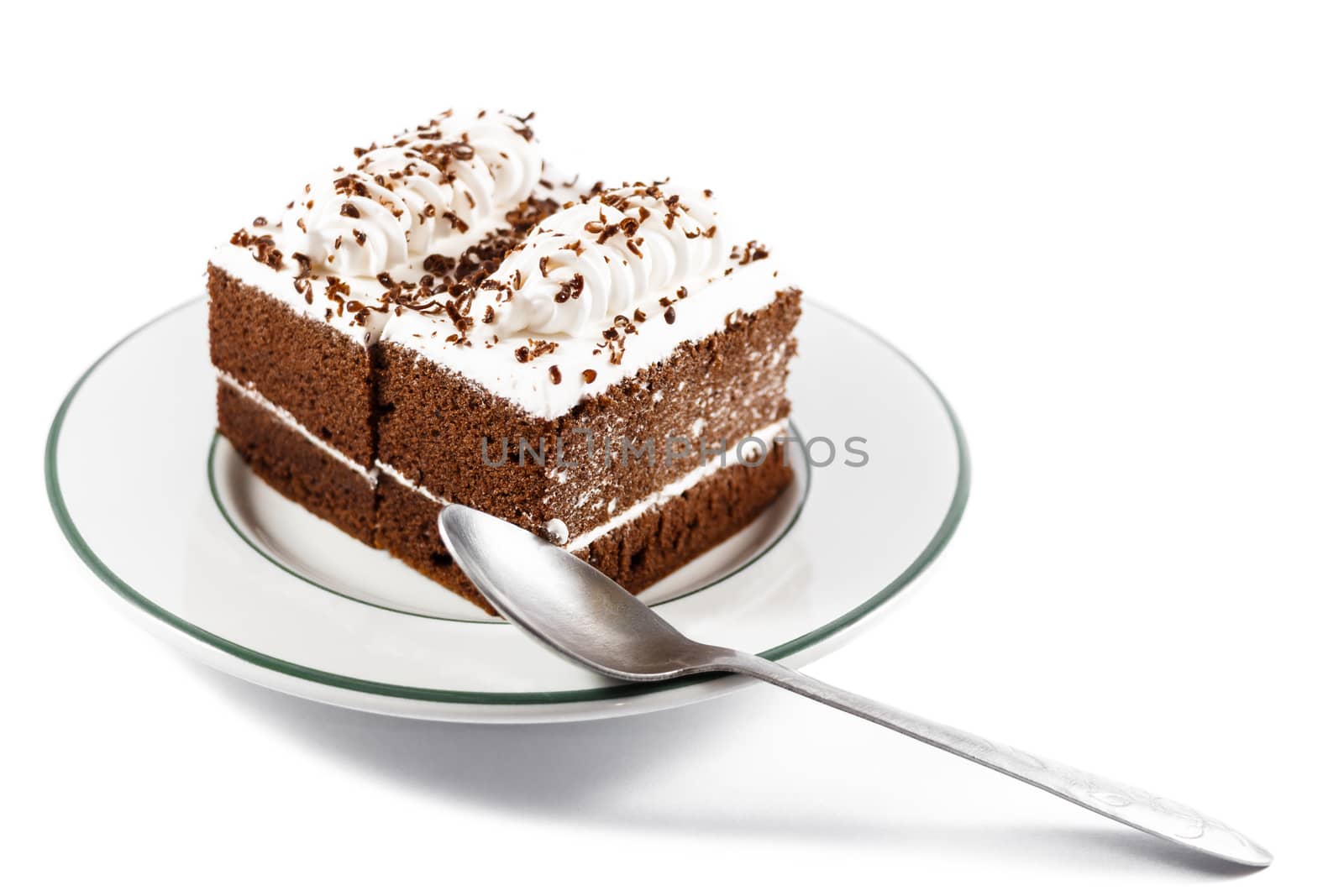 Chocolate cakes with white cream on top and spoon on plate on white background(isolated)