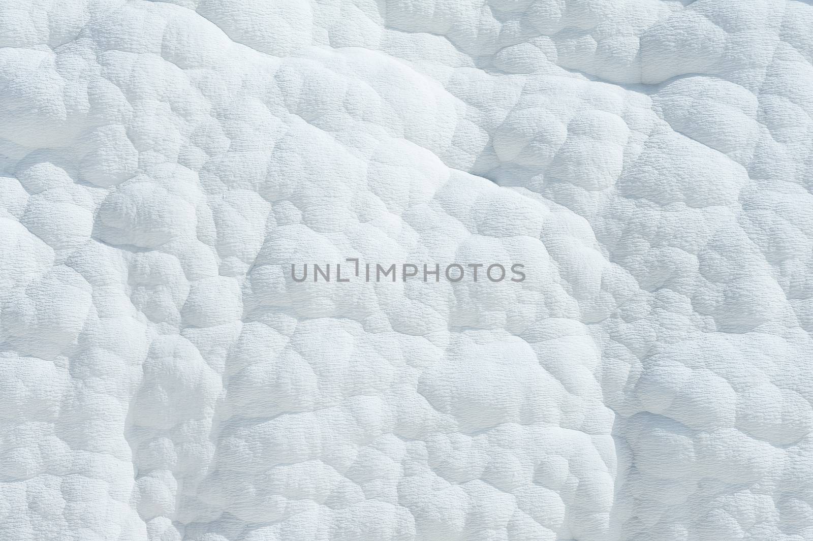 Pamukkale (cotton castle) natural wonder is created by a layers of white travertine looking like cotton, Turkey 