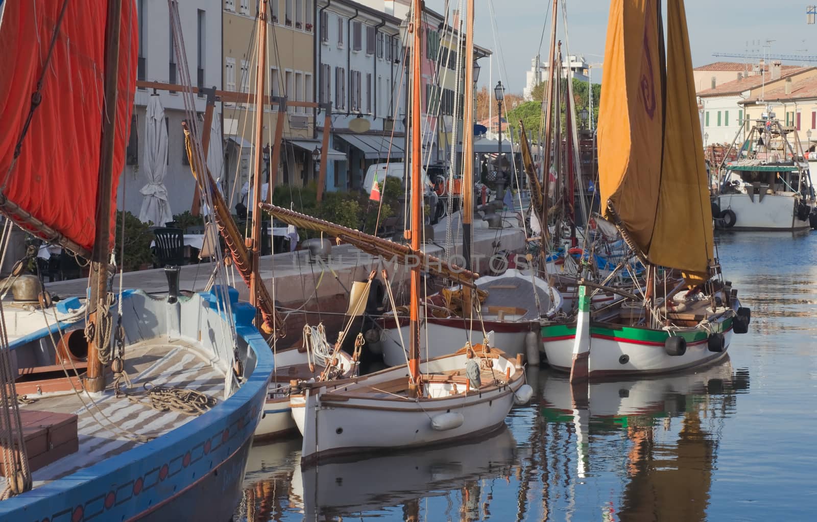 Old fishing boats at the pier in Cesenatico, Italy