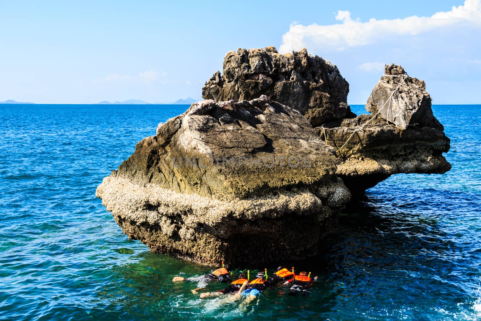 Divers in sea at Trang,Thailand by stockdevil