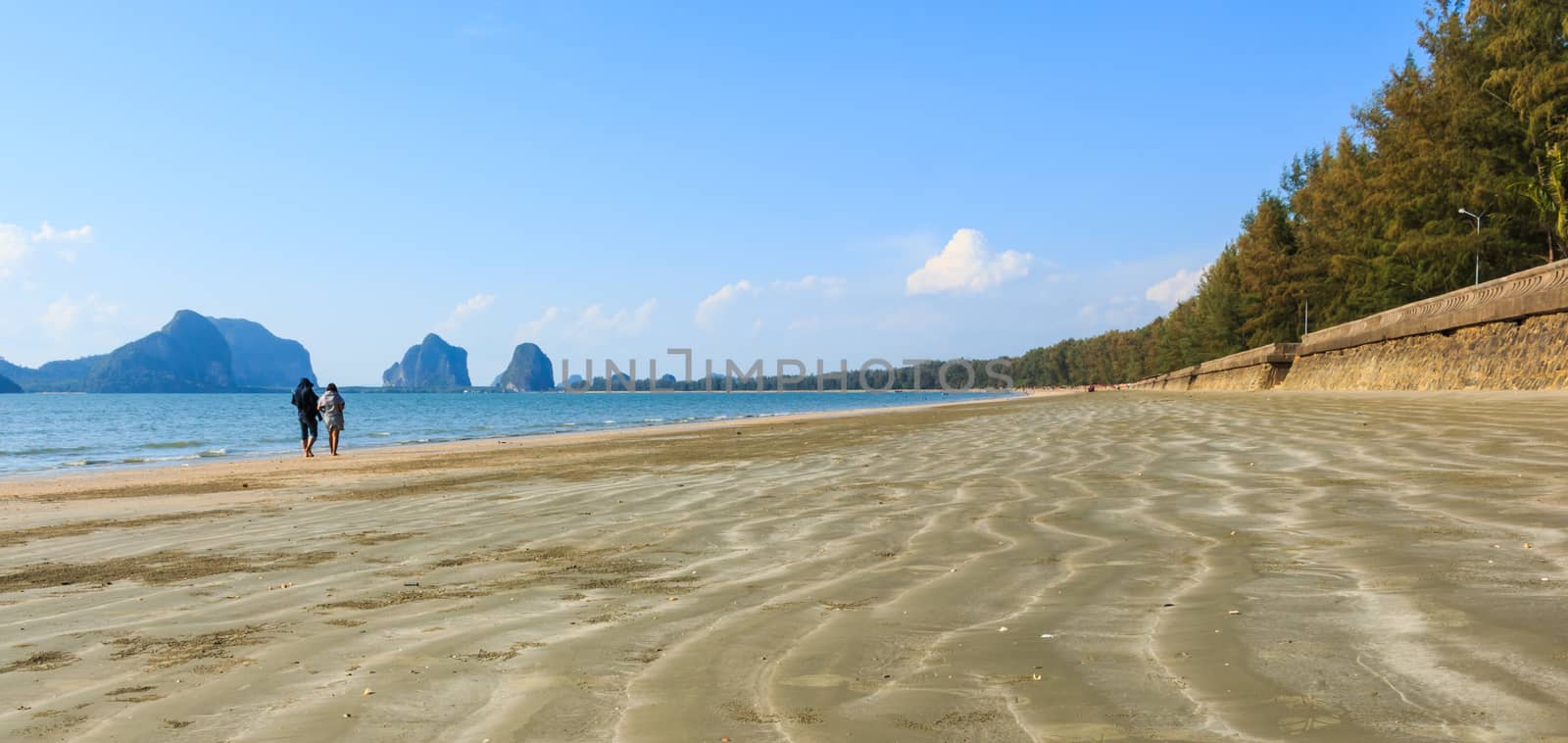 sweetheart on beach with wave of sand at Trang ,Thailand