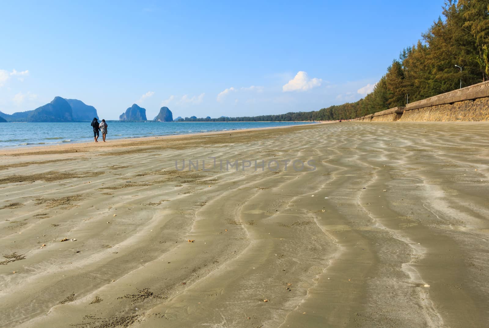 sweetheart on beach with wave of sand at Trang ,Thailand