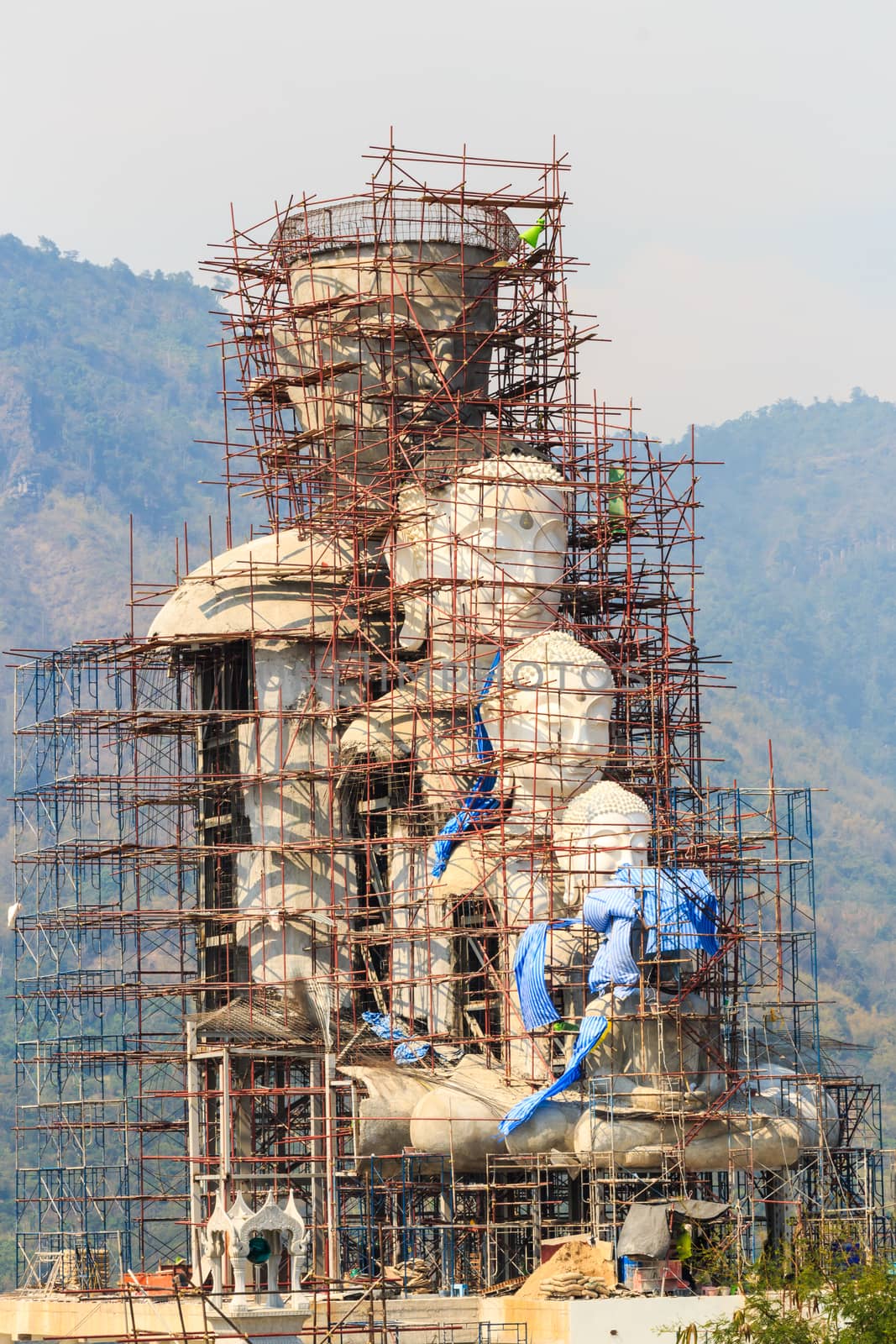 large statue of buddha is under construction by stockdevil