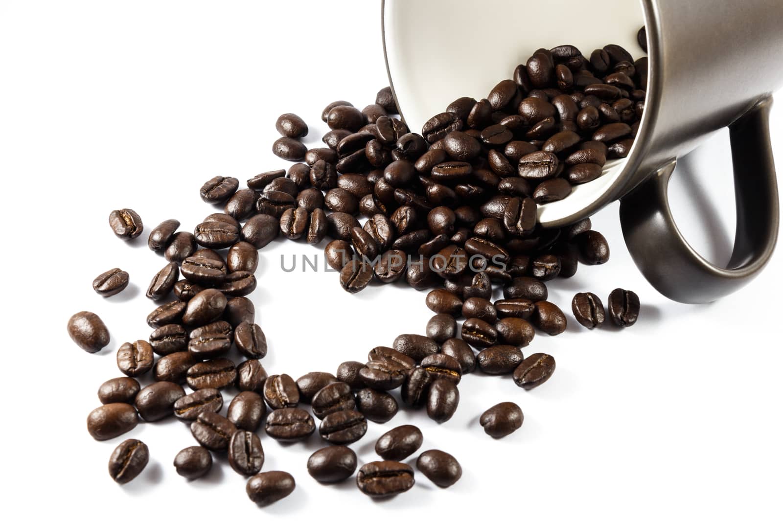 Heart shaped coffee beans from cup