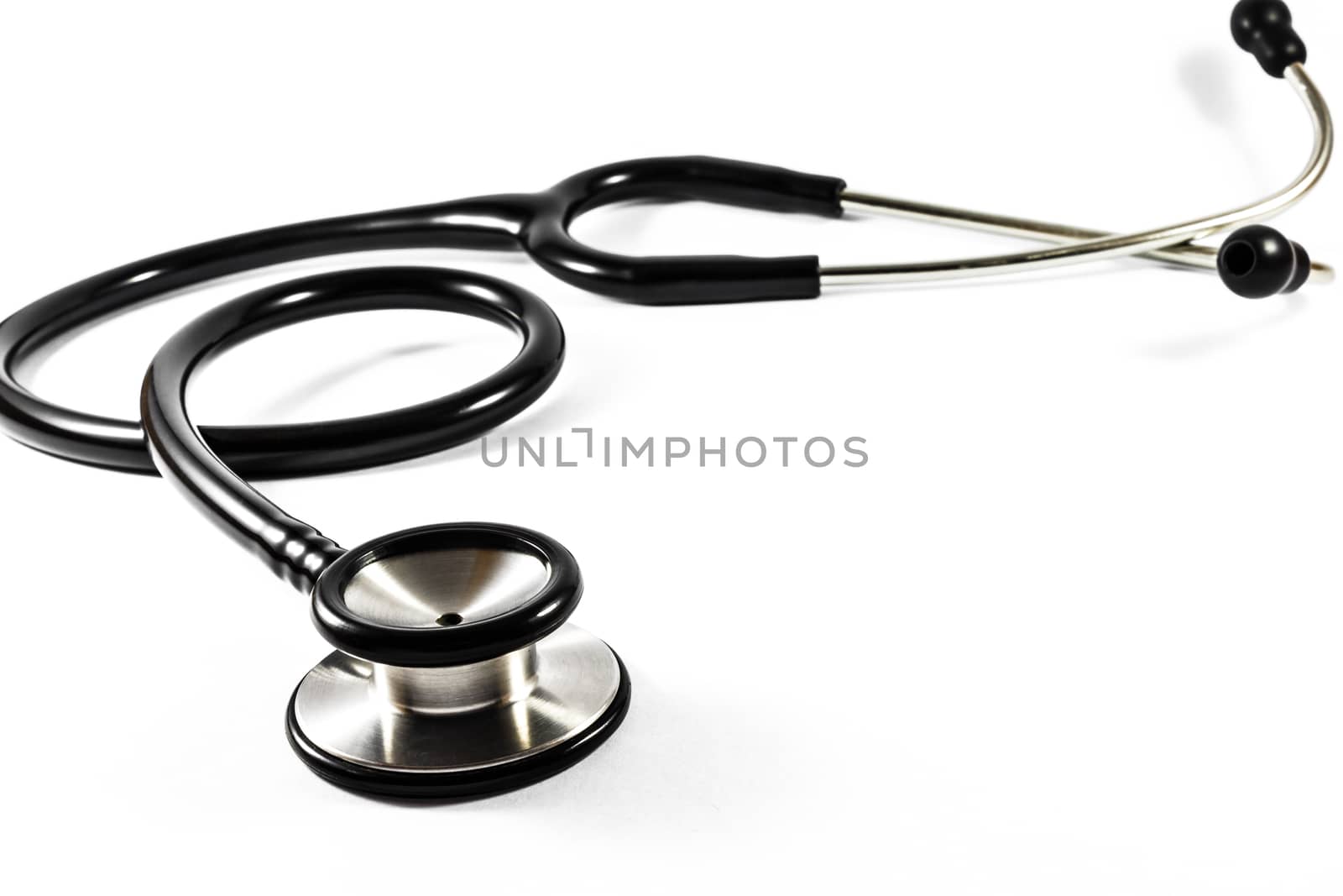 The black color stethoscope on white background