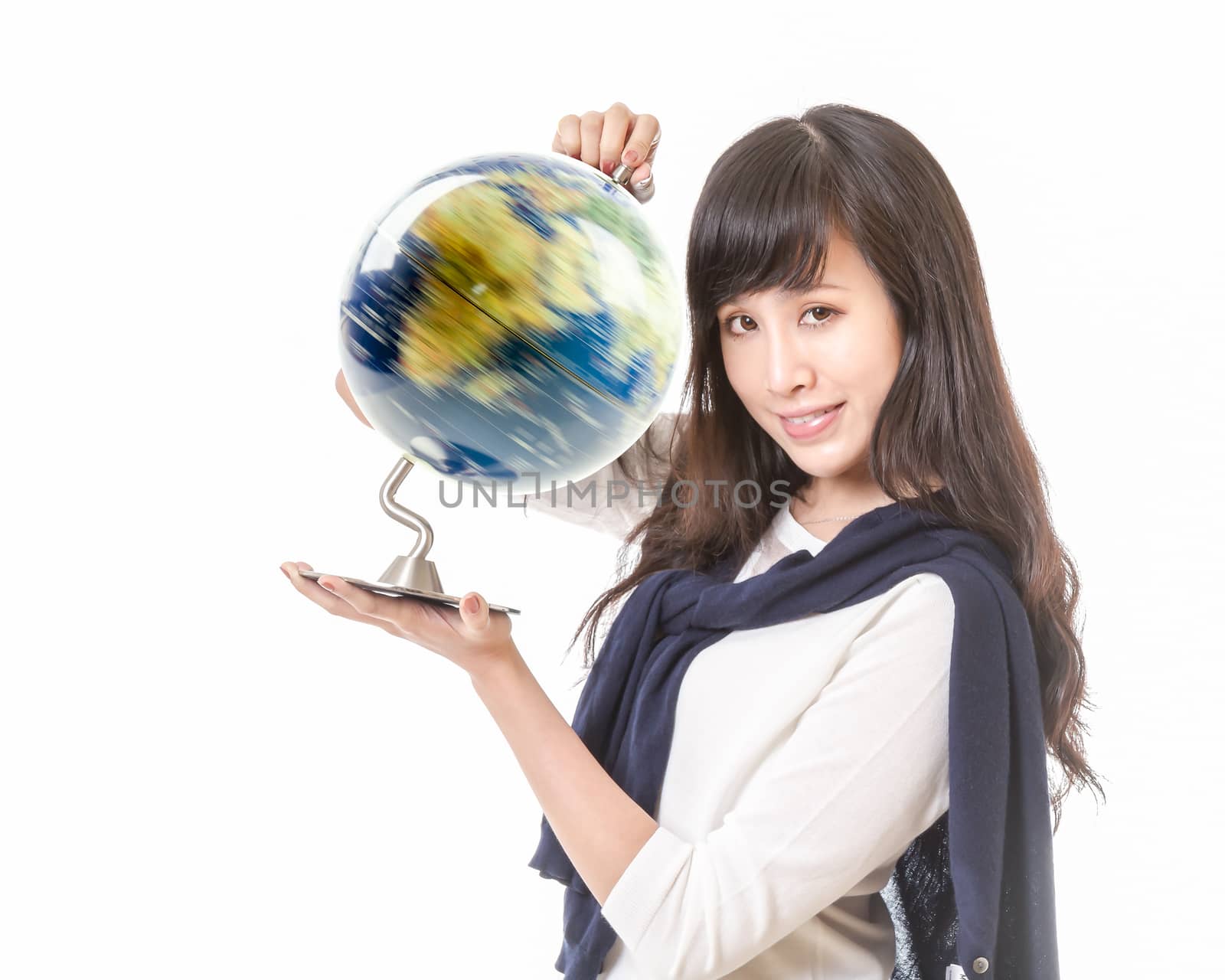 Chinese female with spinning globe of planet earth in her hands