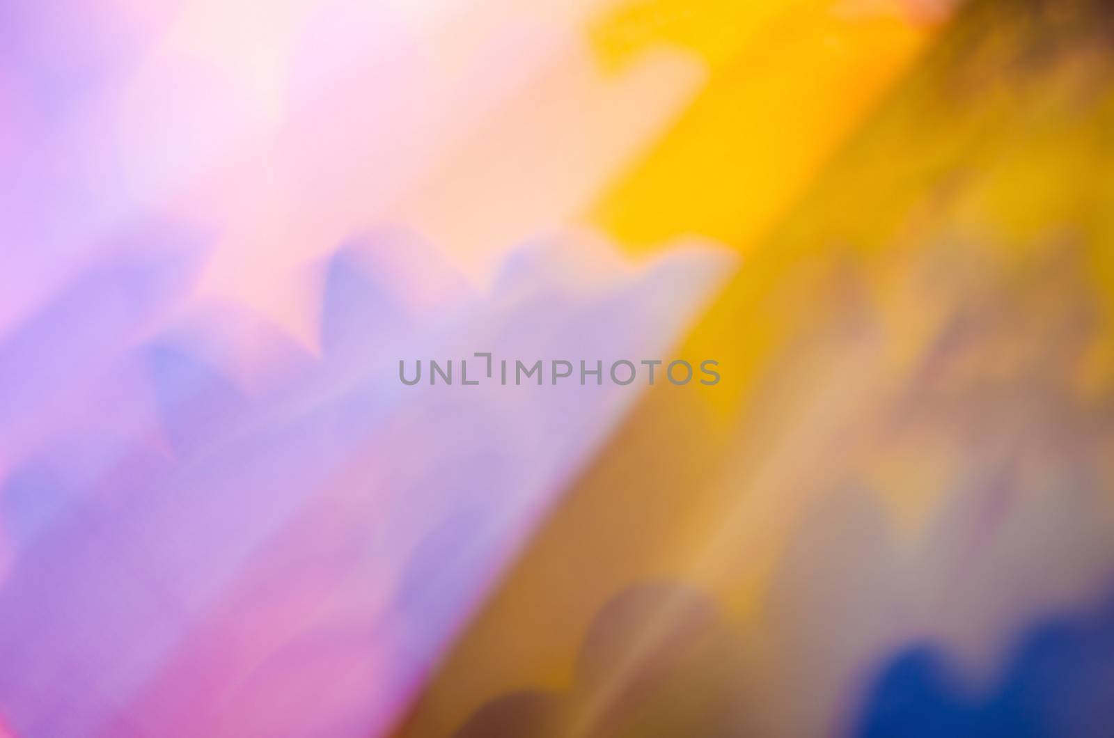 Multicolor blur background with darker right side.