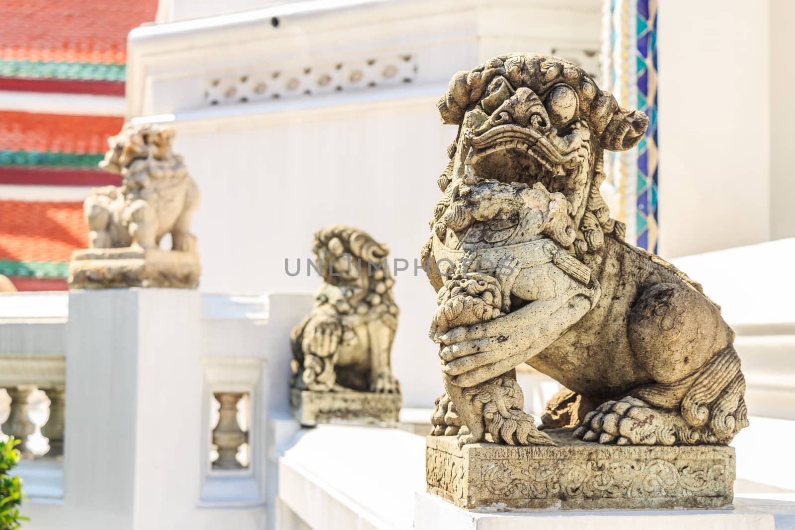 the statue of lion on porch of thai temple (Wat Phra Kaew)