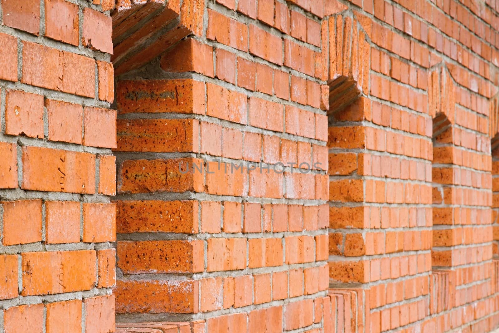 Photo shows a detailed closeup of the stone wall background with window.